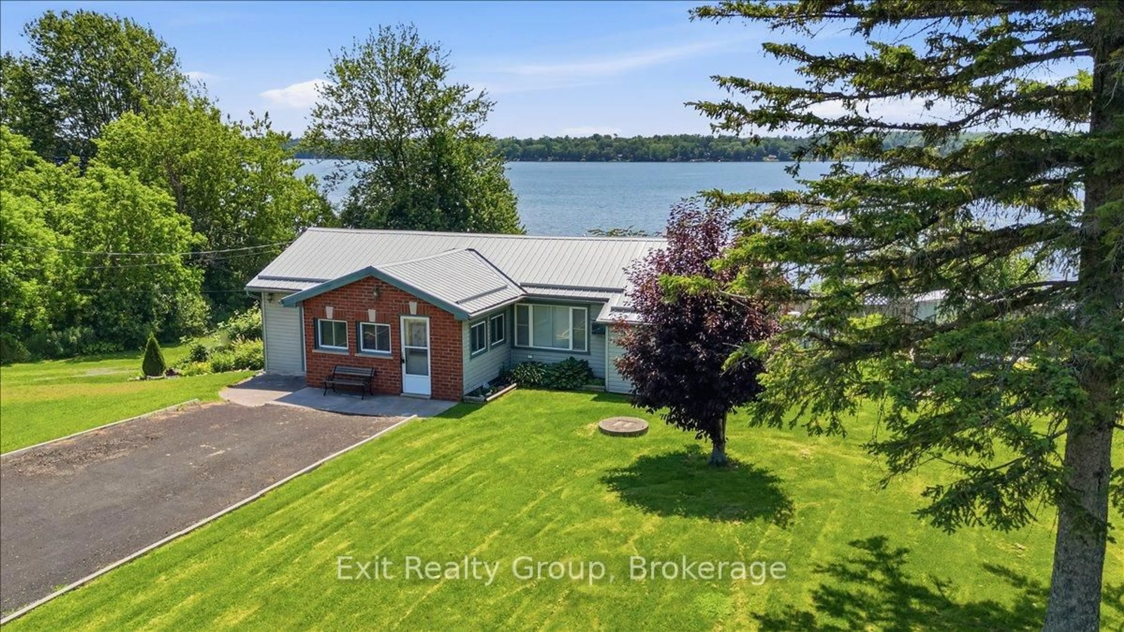 A pic from outside/outdoor area/front of a property/back of a property/a pic from drone, water/lake/river/ocean view for 1083 Lakeside Dr, Prince Edward County Ontario K0K 1T0