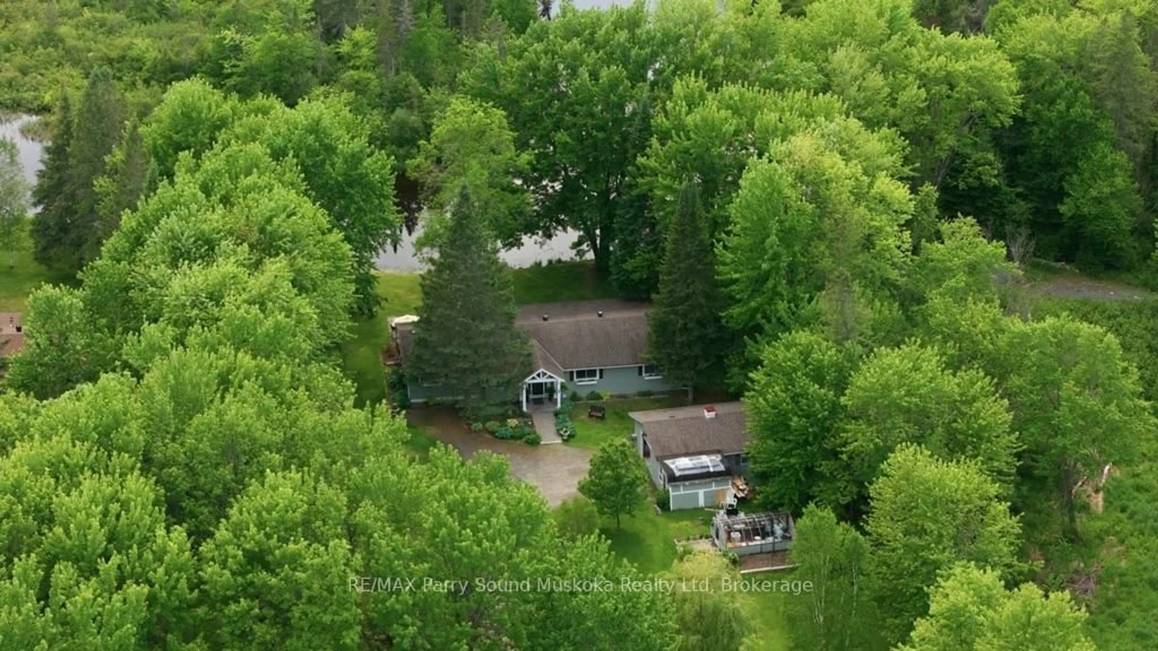A pic from outside/outdoor area/front of a property/back of a property/a pic from drone, forest/trees view for 49 Maple St, Seguin Ontario P0C 1J0