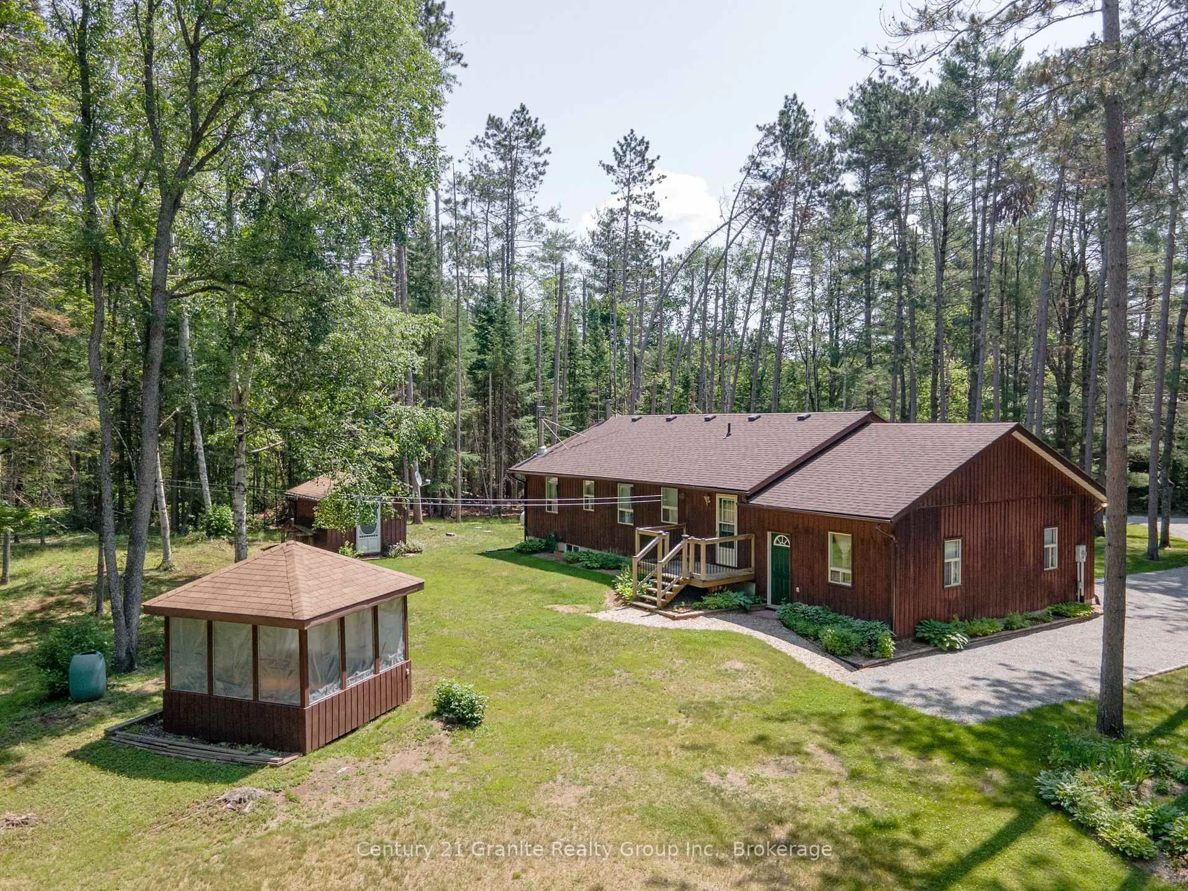 A pic from outside/outdoor area/front of a property/back of a property/a pic from drone, forest/trees view for 1161 Howland Junction Rd, Minden Hills Ontario K0M 2K0