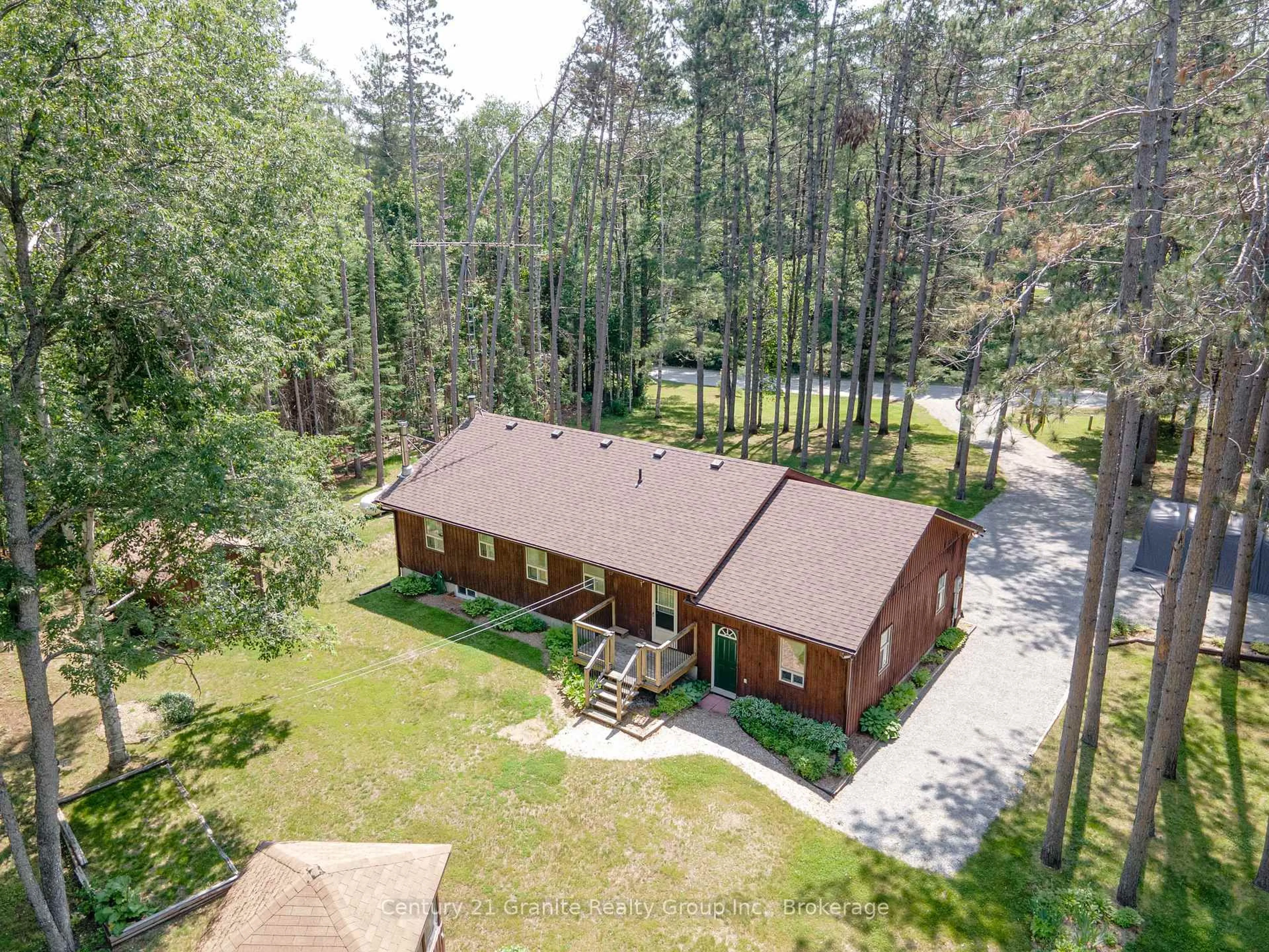 A pic from outside/outdoor area/front of a property/back of a property/a pic from drone, forest/trees view for 1161 Howland Junction Rd, Minden Hills Ontario K0M 2K0