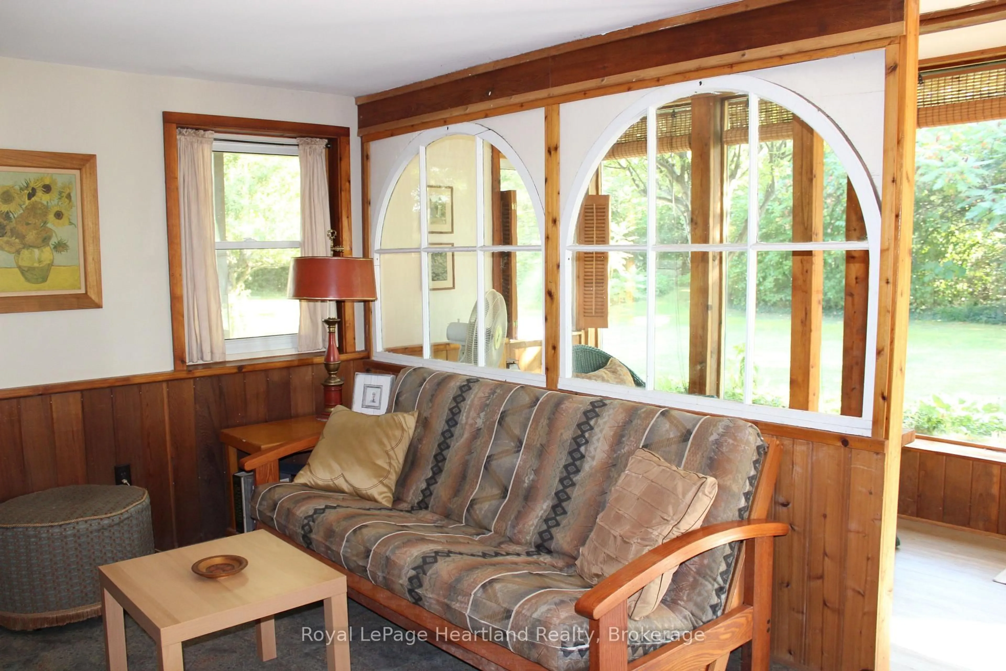 Living room with furniture, wood/laminate floor for 77484 MELENA Dr, Bluewater Ontario N0M 1G0