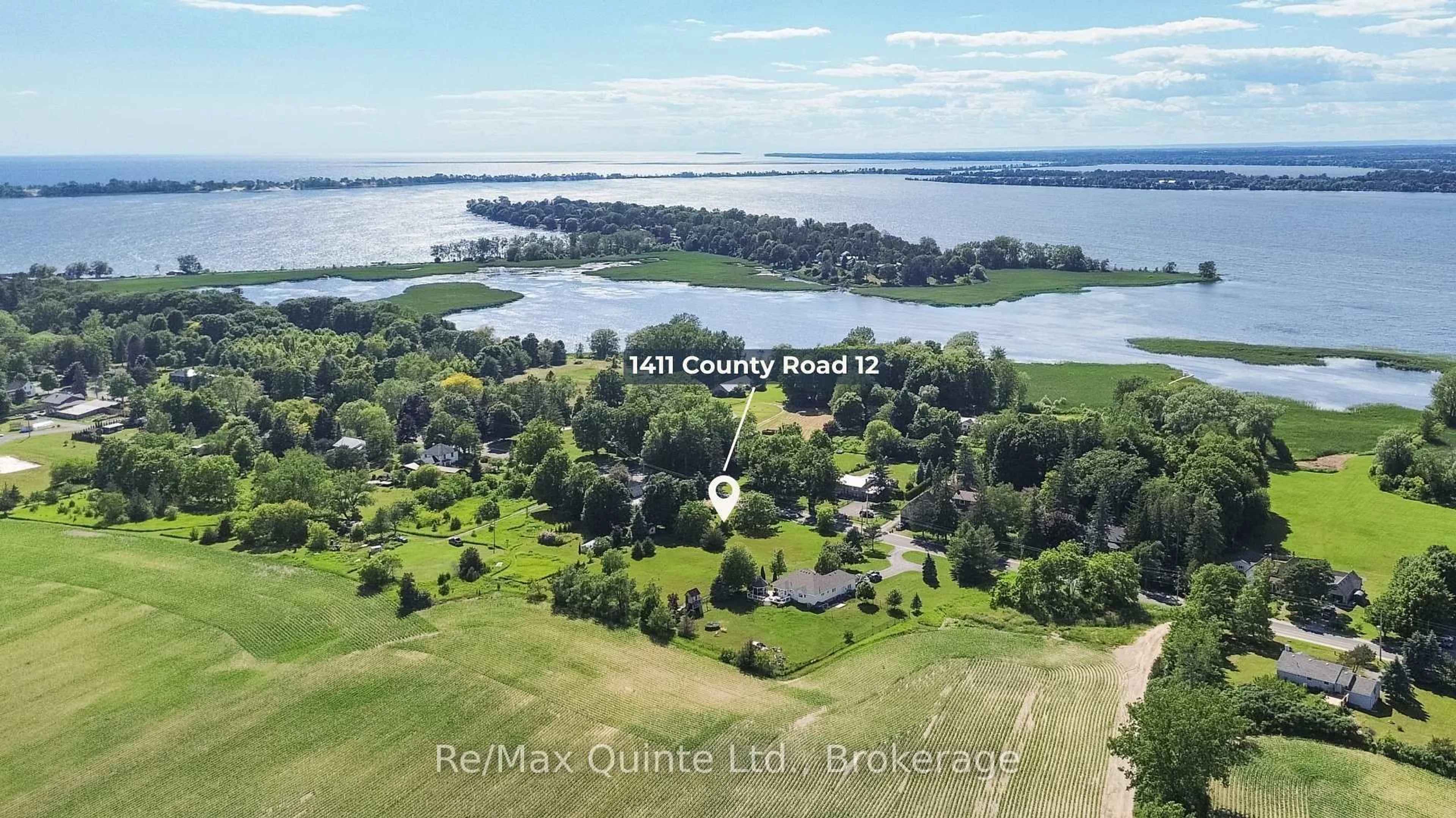 A pic from outside/outdoor area/front of a property/back of a property/a pic from drone, water/lake/river/ocean view for 1411 County Road 12, Prince Edward County Ontario K0K 2T0