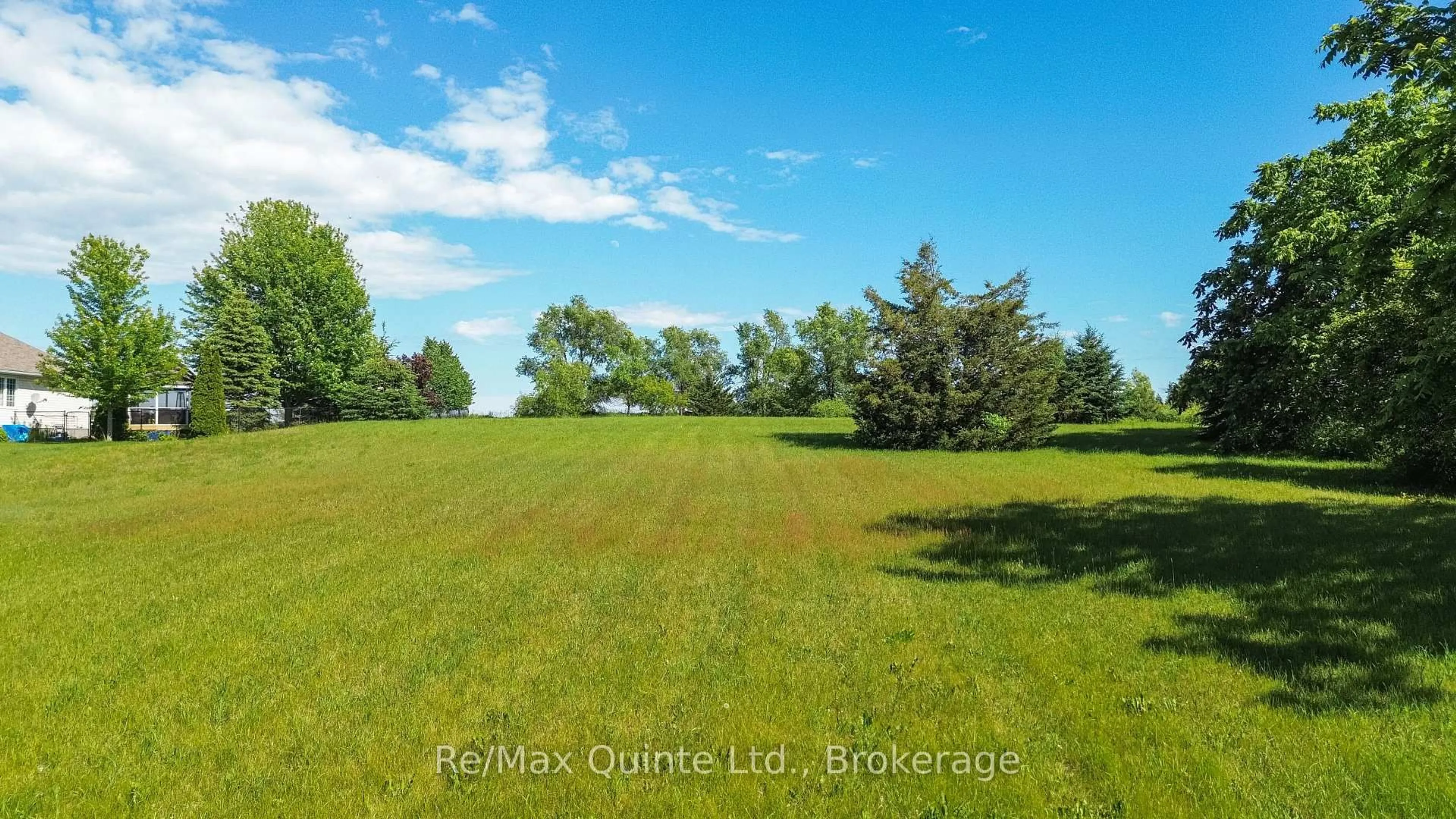 A pic from outside/outdoor area/front of a property/back of a property/a pic from drone, water/lake/river/ocean view for 1411 County Road 12, Prince Edward County Ontario K0K 2T0