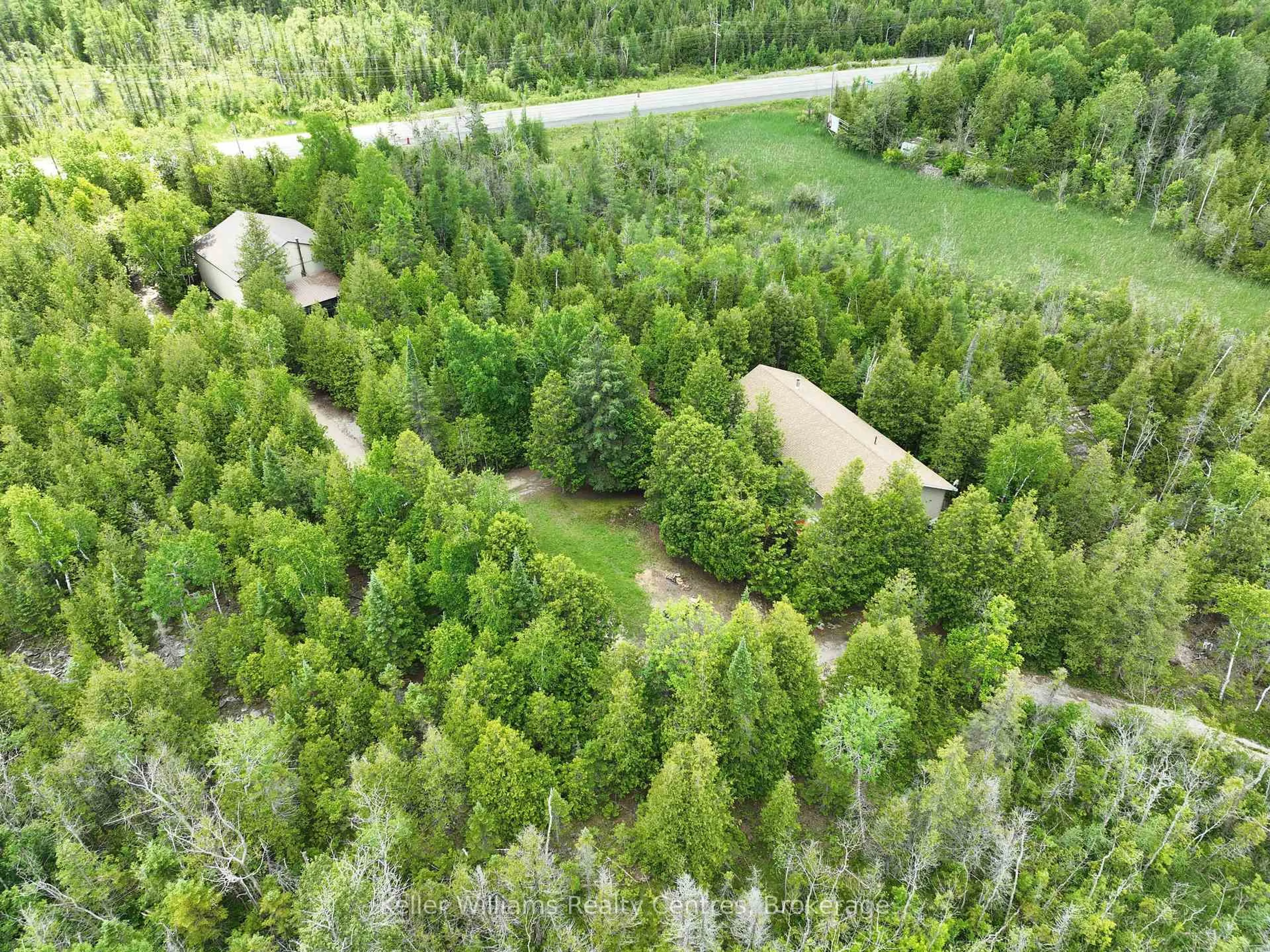 A pic from outside/outdoor area/front of a property/back of a property/a pic from drone, forest/trees view for 454 Highway 6, South Bruce Peninsula Ontario N0H 2T0