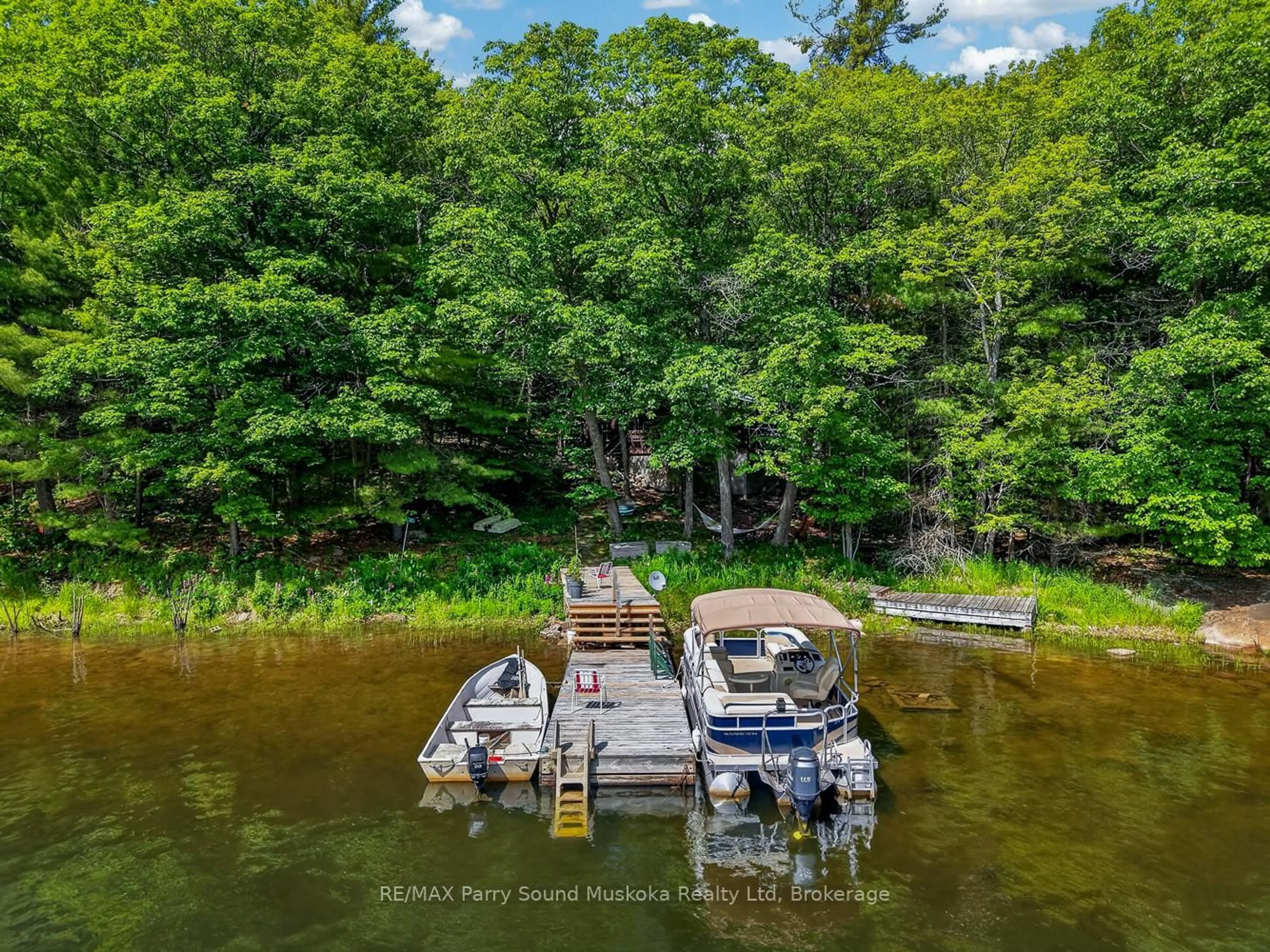 A pic from outside/outdoor area/front of a property/back of a property/a pic from drone, water/lake/river/ocean view for 91 Water Acc Zone Lane, Carling Ontario P0G 1G0