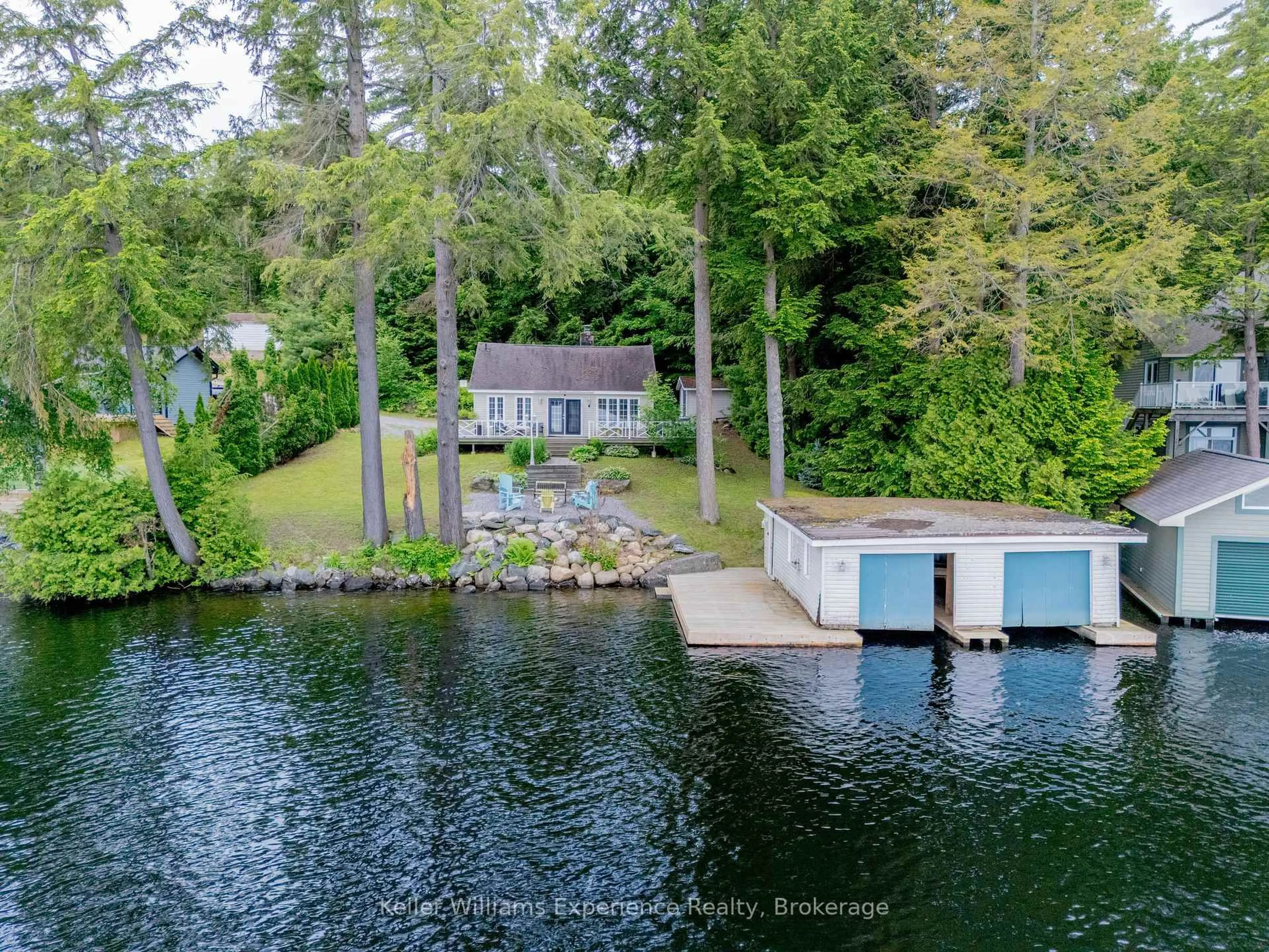A pic from outside/outdoor area/front of a property/back of a property/a pic from drone, water/lake/river/ocean view for 1018 Georgina Way #2, Gravenhurst Ontario P1P 1R2
