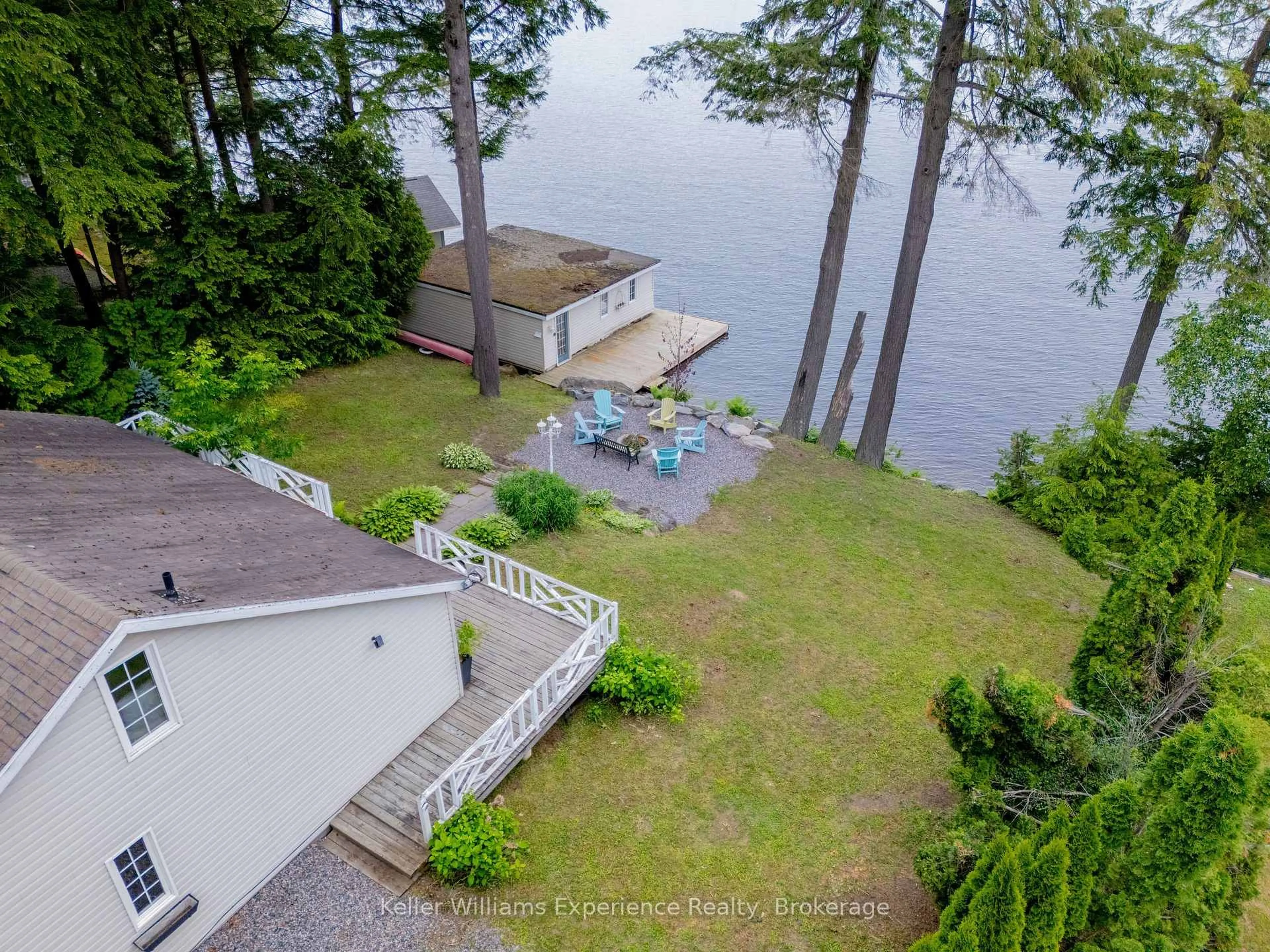 A pic from outside/outdoor area/front of a property/back of a property/a pic from drone, water/lake/river/ocean view for 1018 Georgina Way #2, Gravenhurst Ontario P1P 1R2