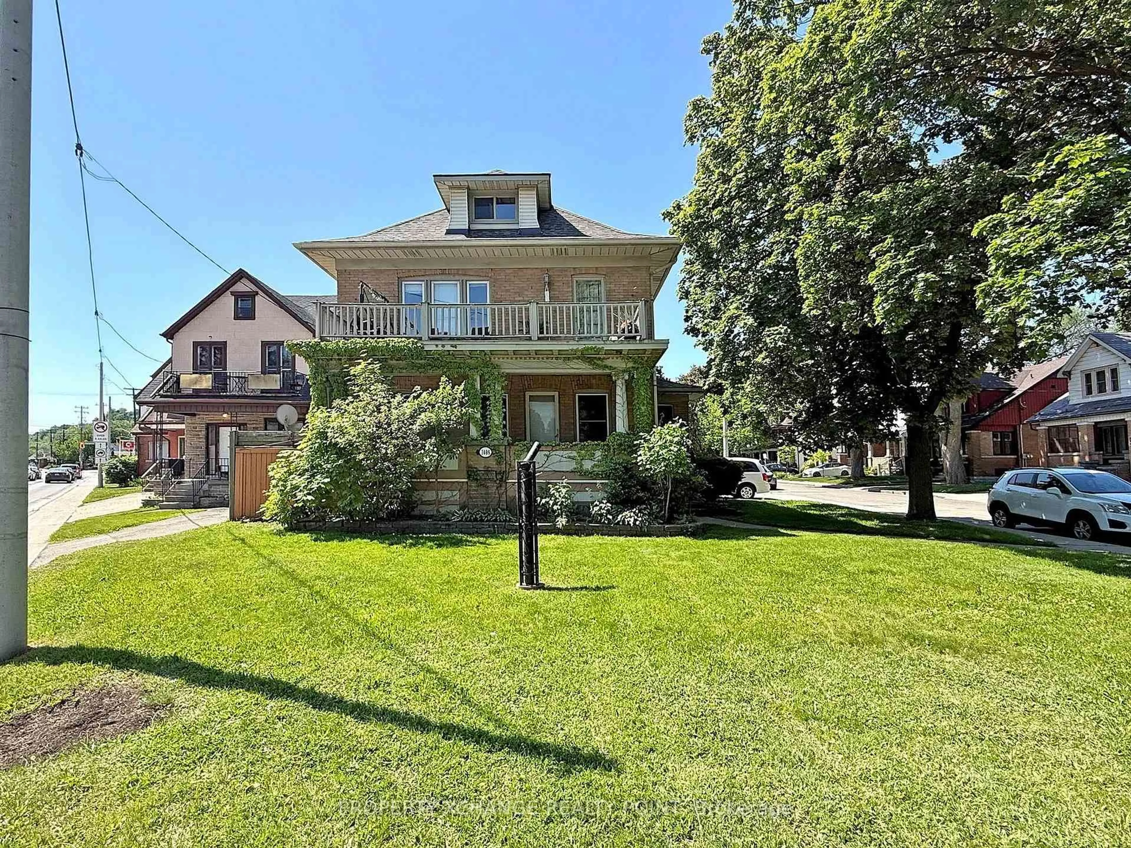 A pic from outside/outdoor area/front of a property/back of a property/a pic from drone, street for 1408 King St, Hamilton Ontario L8M 1H8