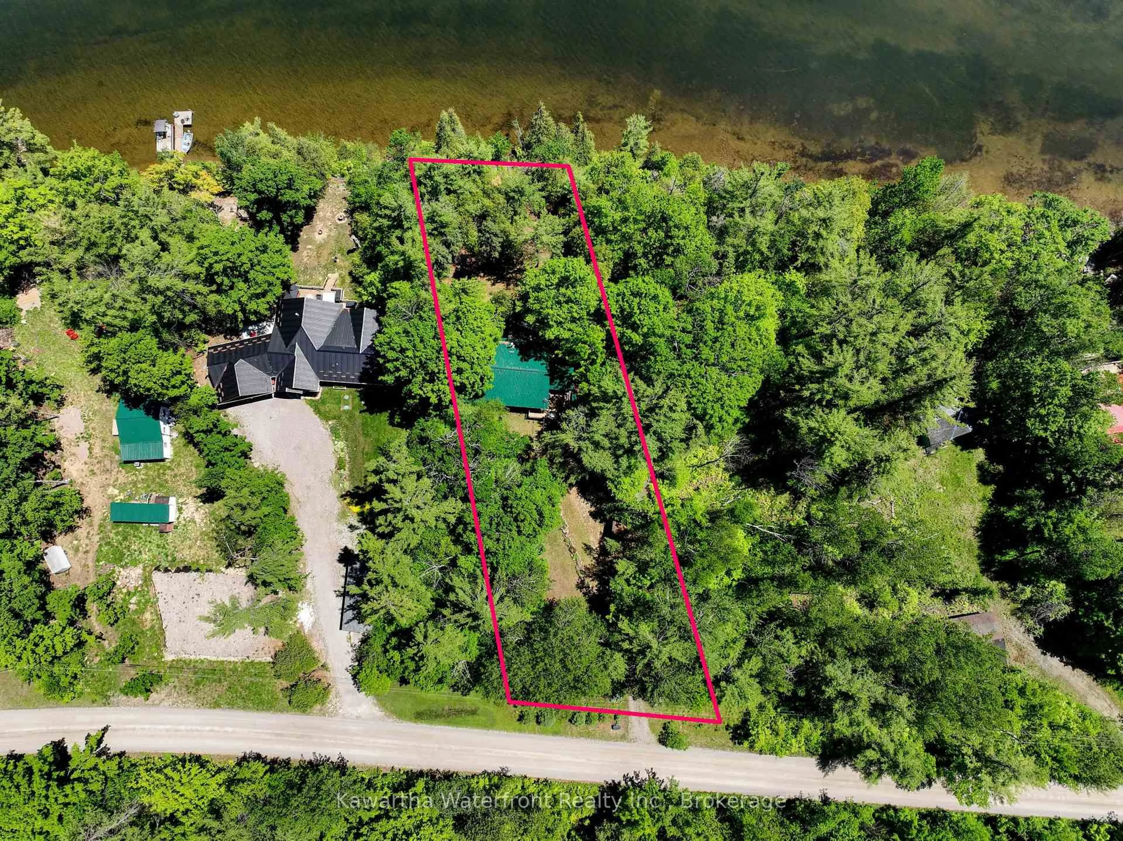 A pic from outside/outdoor area/front of a property/back of a property/a pic from drone, water/lake/river/ocean view for 14 Baker Blvd, Kawartha Lakes Ontario K0M 2B0
