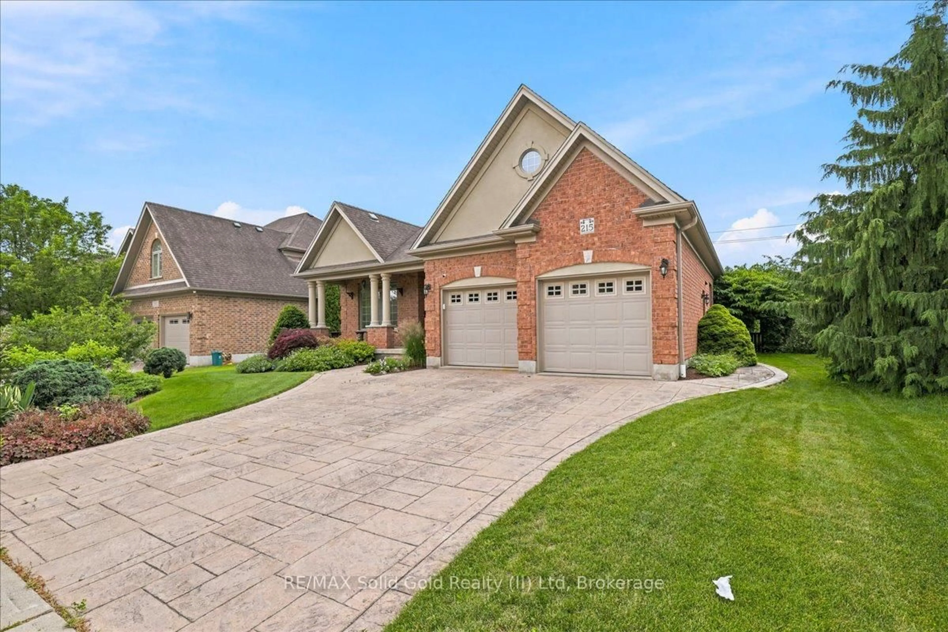 Home with brick exterior material, street for 215 Terrace Wood Cres, Kitchener Ontario N2P 2T3