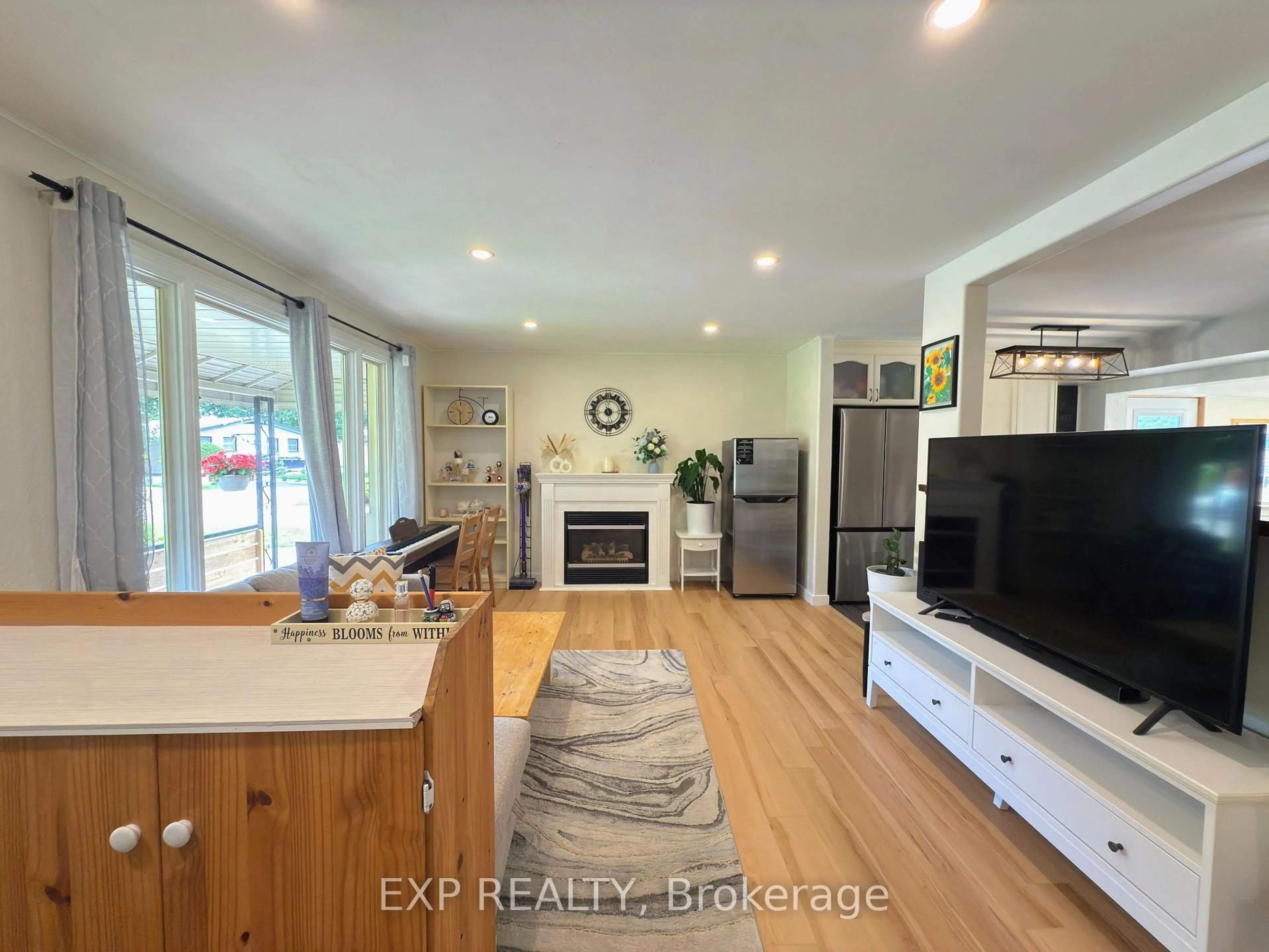 Open concept kitchen, wood/laminate floor for 438 Magnolia Cres, London East Ontario N5Y 4S9