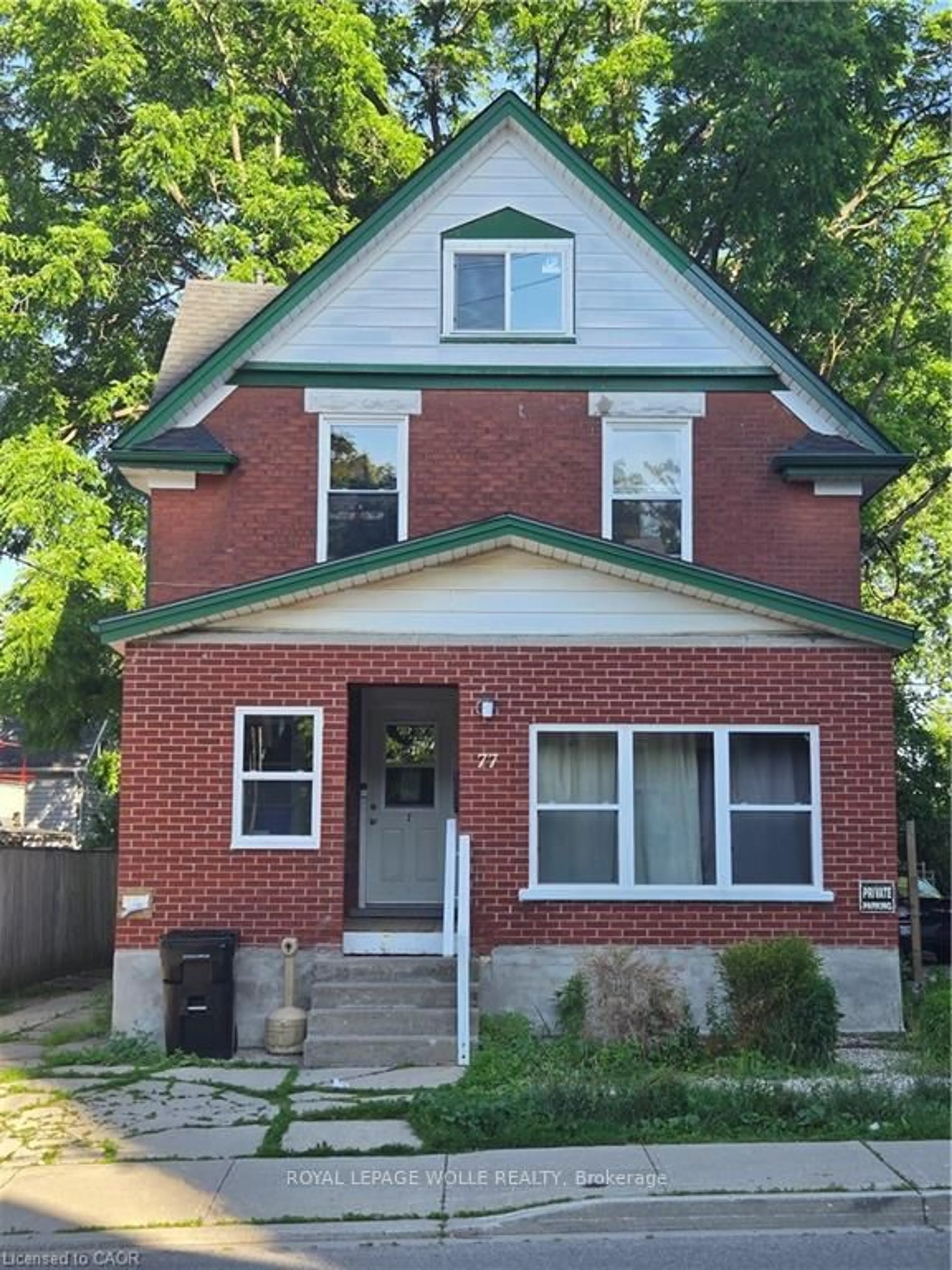 Home with brick exterior material, street for 77 Cedar St, Kitchener Ontario N2G 3L6