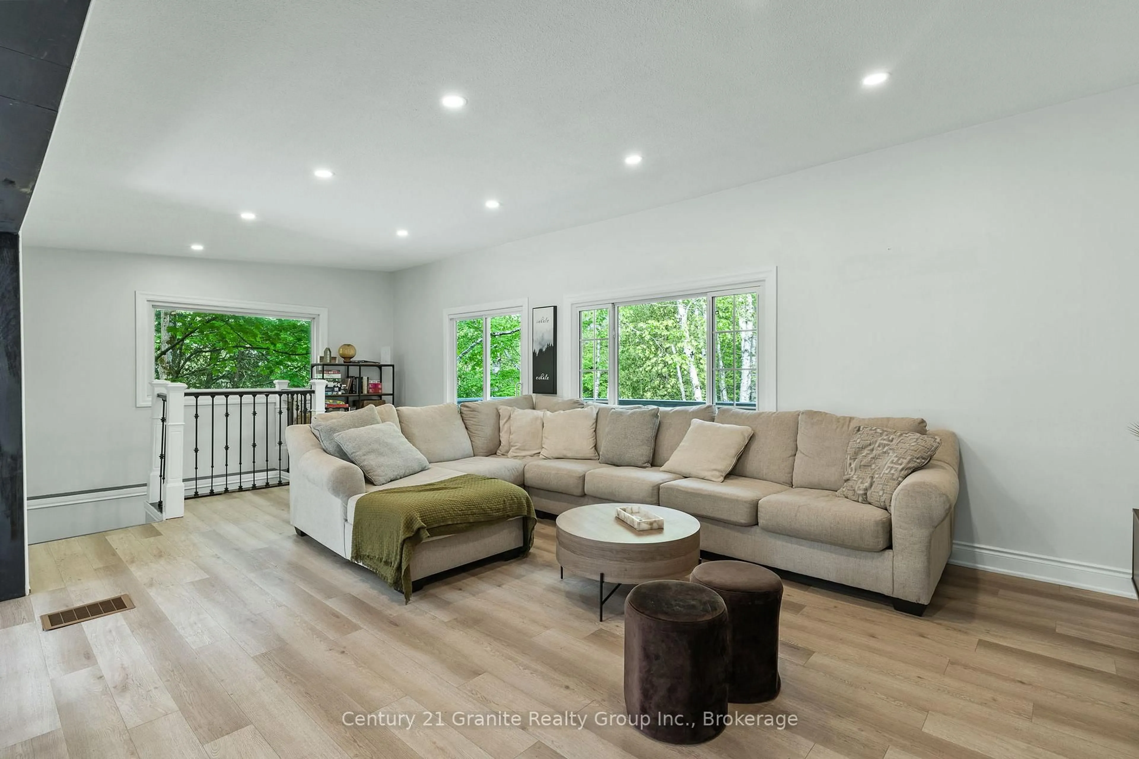 Living room with furniture, wood/laminate floor for 1630 Kashagawigamog Lake Rd, Minden Hills Ontario K0M 2K0