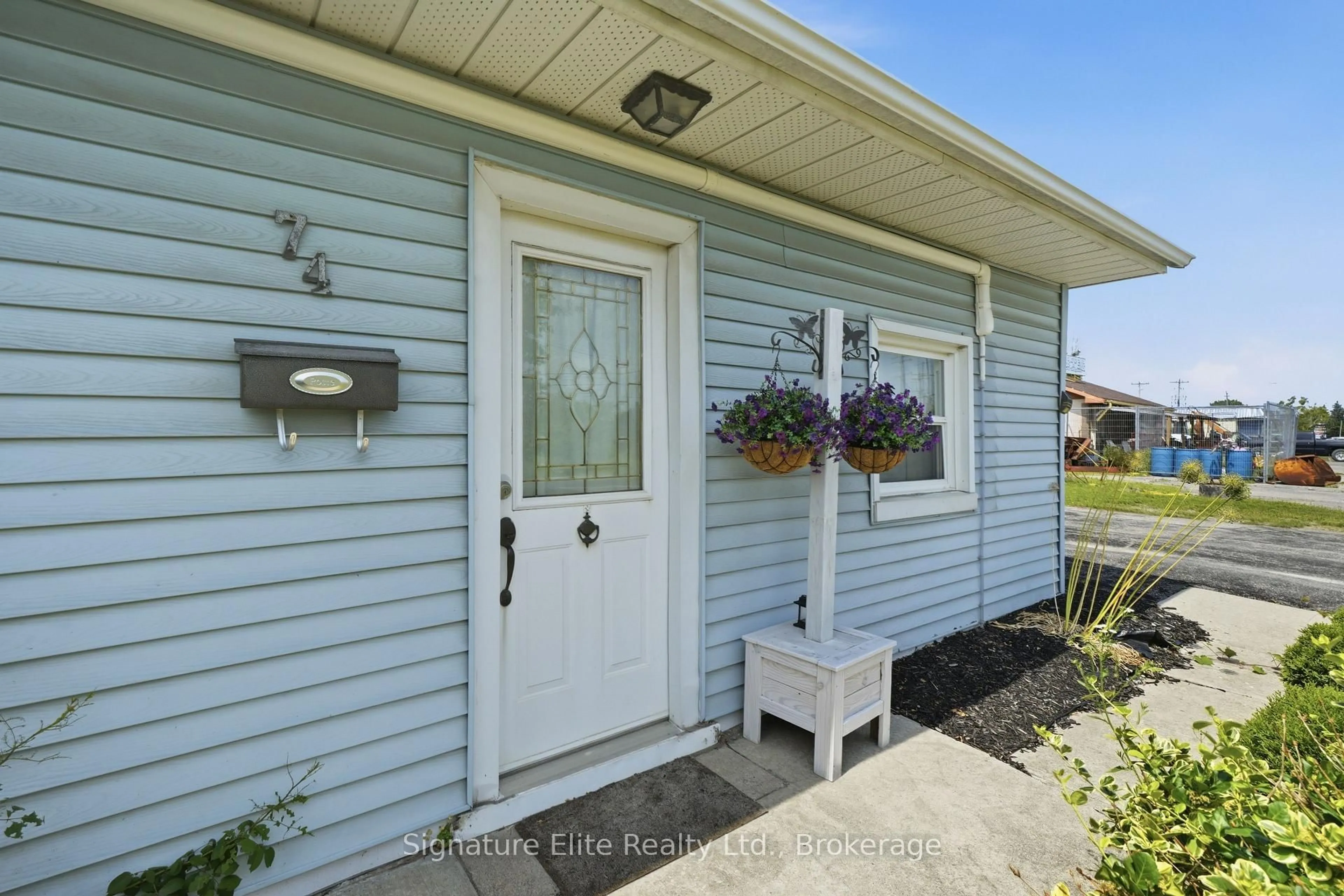 Home with vinyl exterior material, street for 74 Highway 33, Quinte West Ontario K8V 5P6