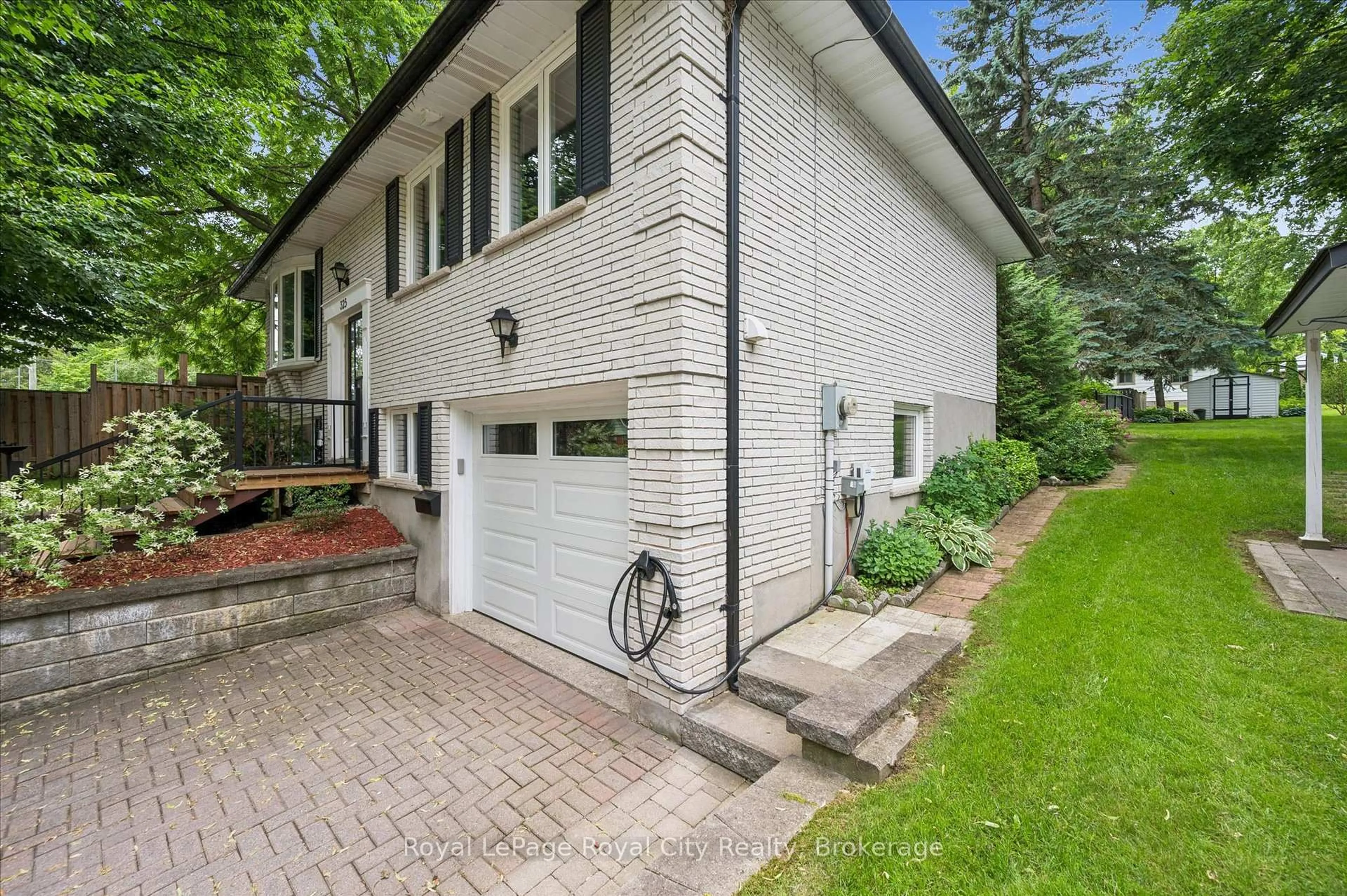 Home with brick exterior material, street for 325 Provost Lane, Centre Wellington Ontario N1M 2N2