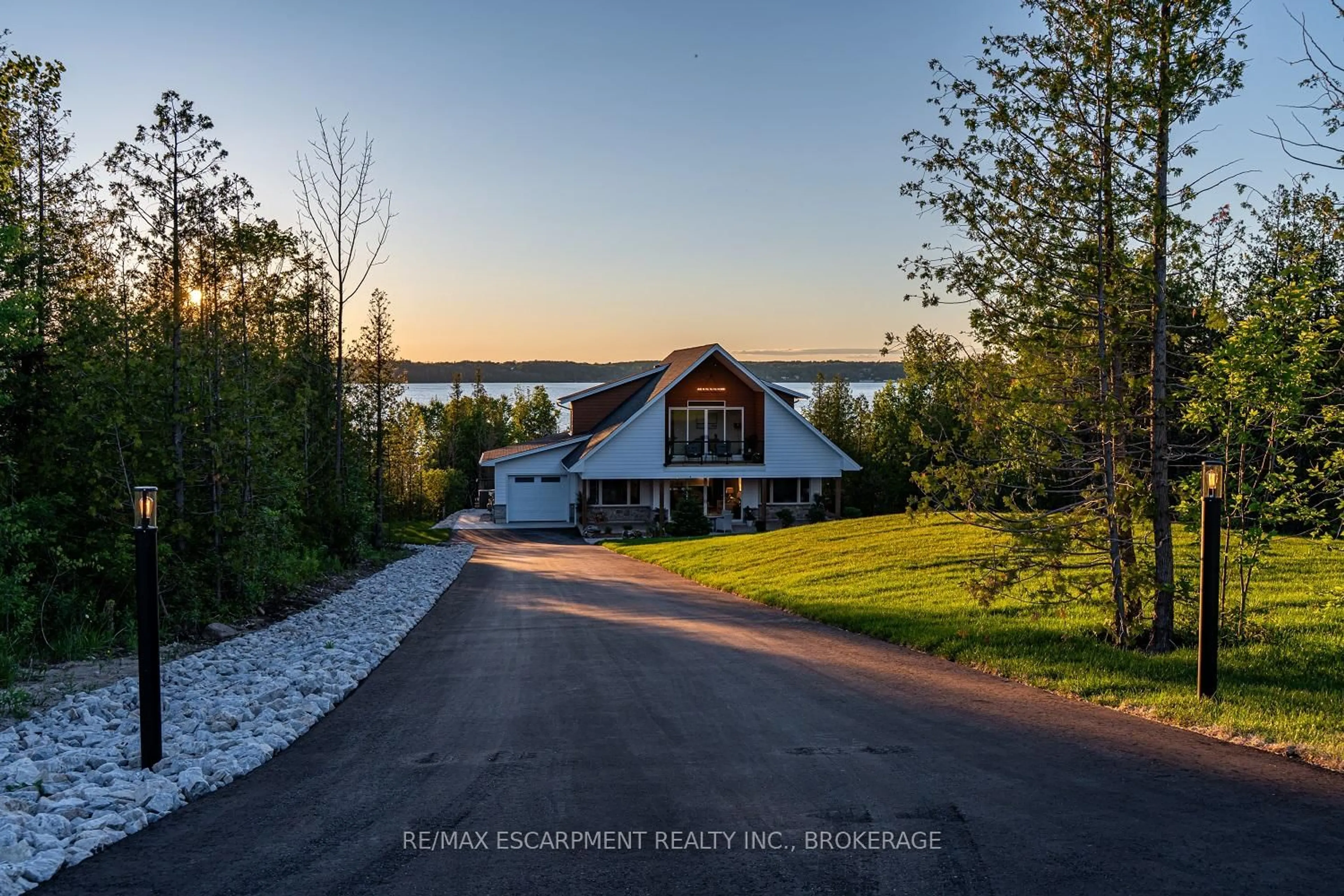 A pic from outside/outdoor area/front of a property/back of a property/a pic from drone, water/lake/river/ocean view for 165 Wilson Dr, Georgian Bluffs Ontario N0H 2T0