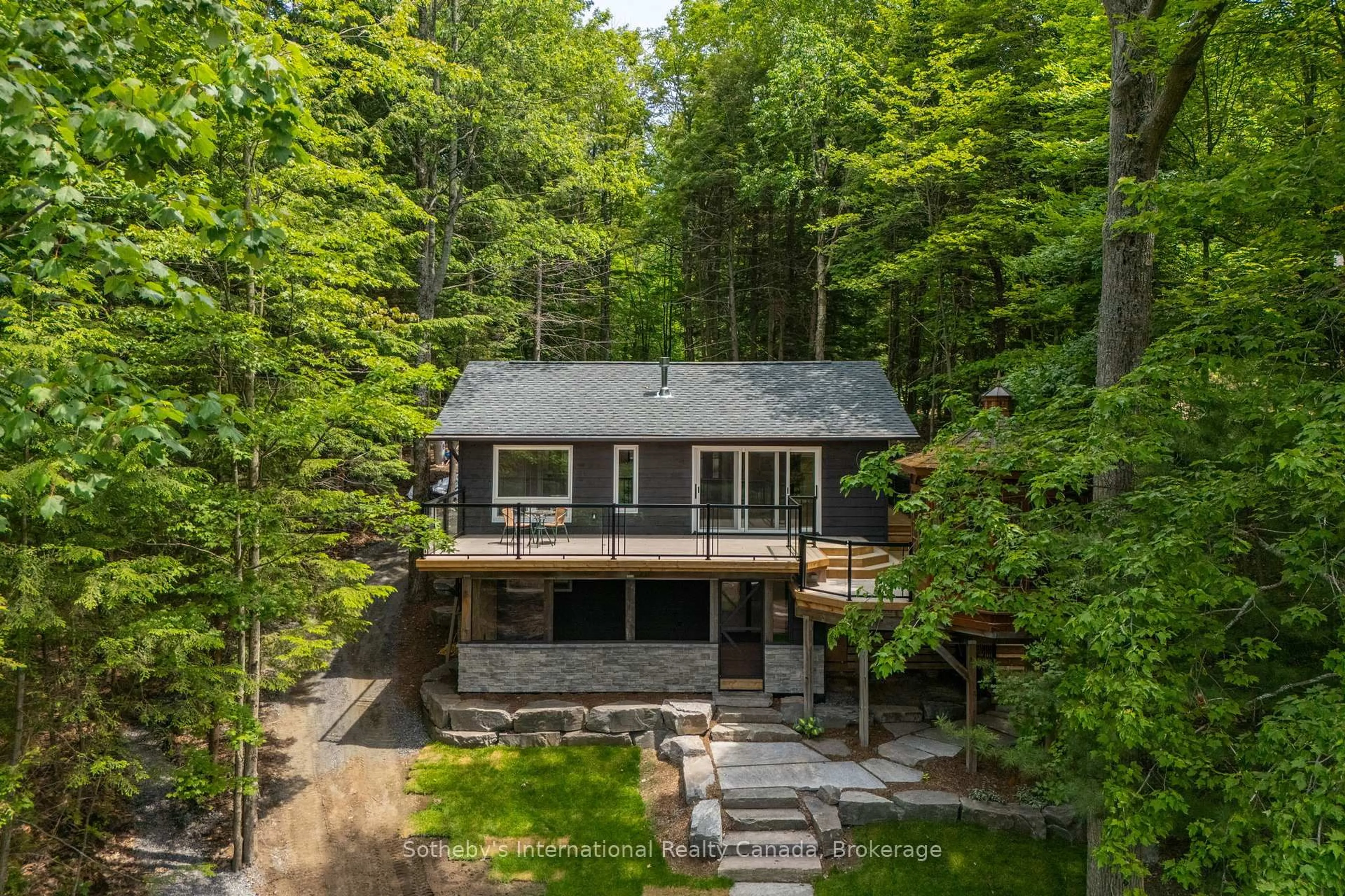 A pic from outside/outdoor area/front of a property/back of a property/a pic from drone, forest/trees view for 1023 Strachan Pt Rd, Muskoka Lakes Ontario P0C 1A0