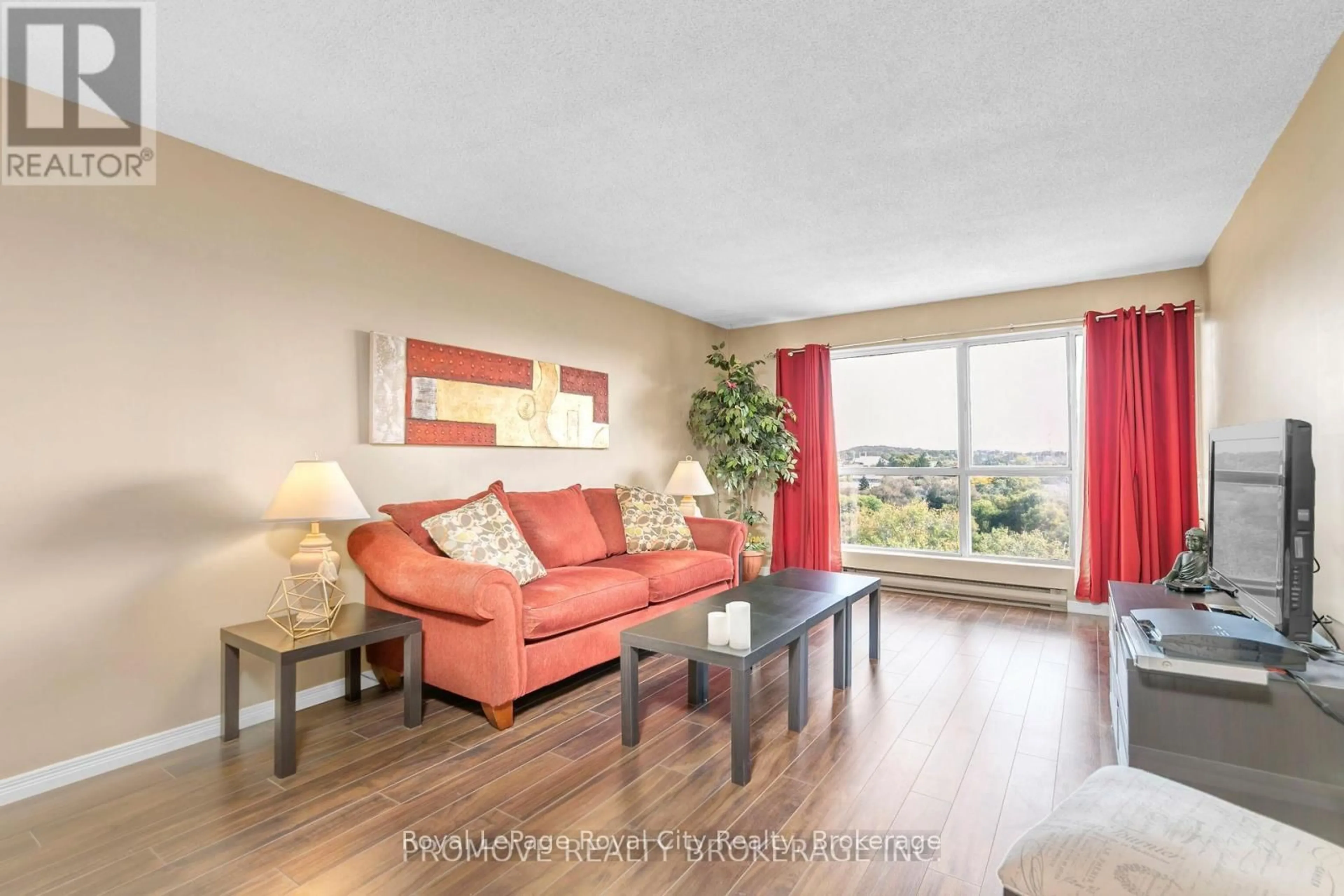 Living room with furniture, wood/laminate floor for 358 Waterloo Ave #906, Guelph Ontario N1H 7Y3