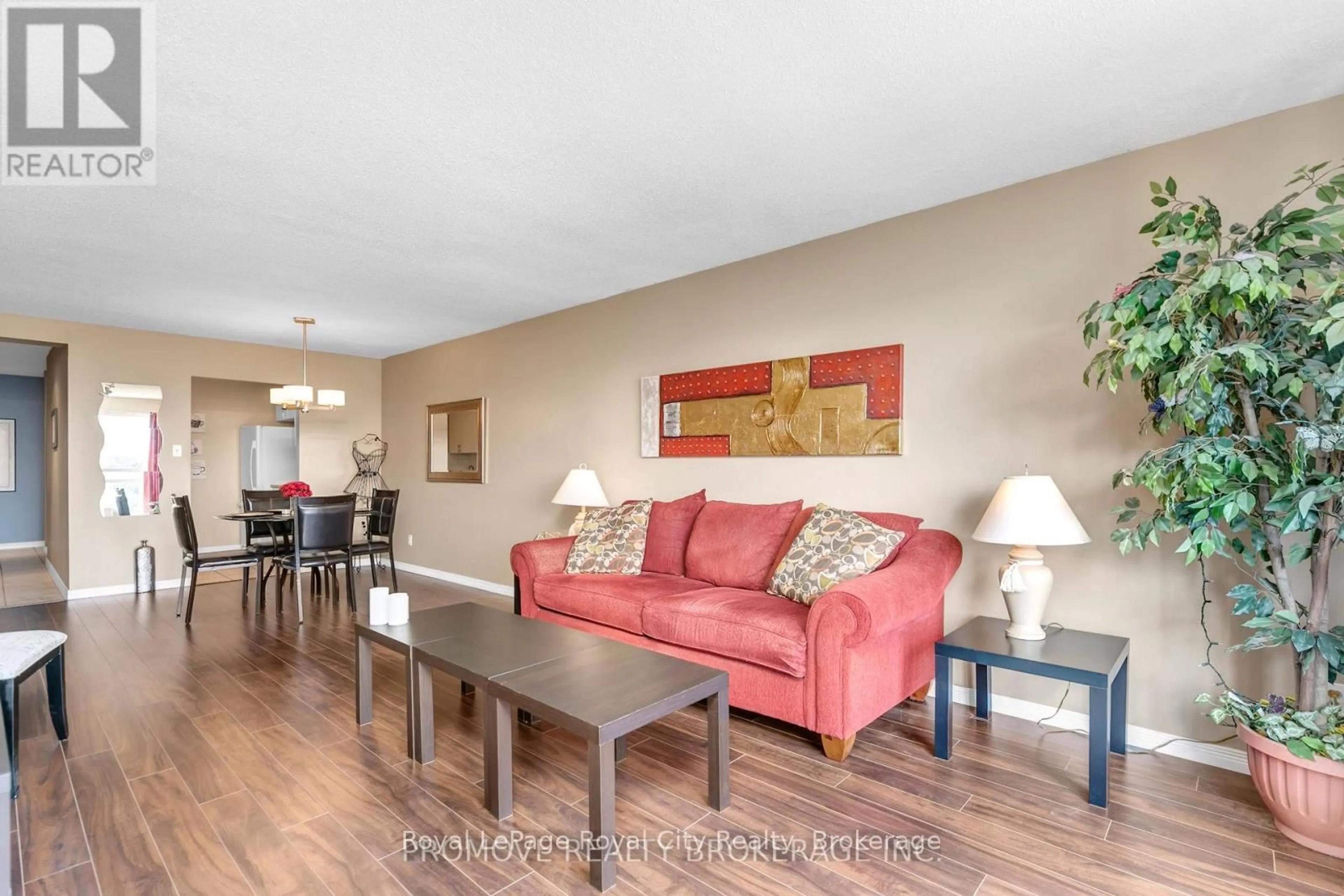 Living room with furniture, wood/laminate floor for 358 Waterloo Ave #906, Guelph Ontario N1H 7Y3