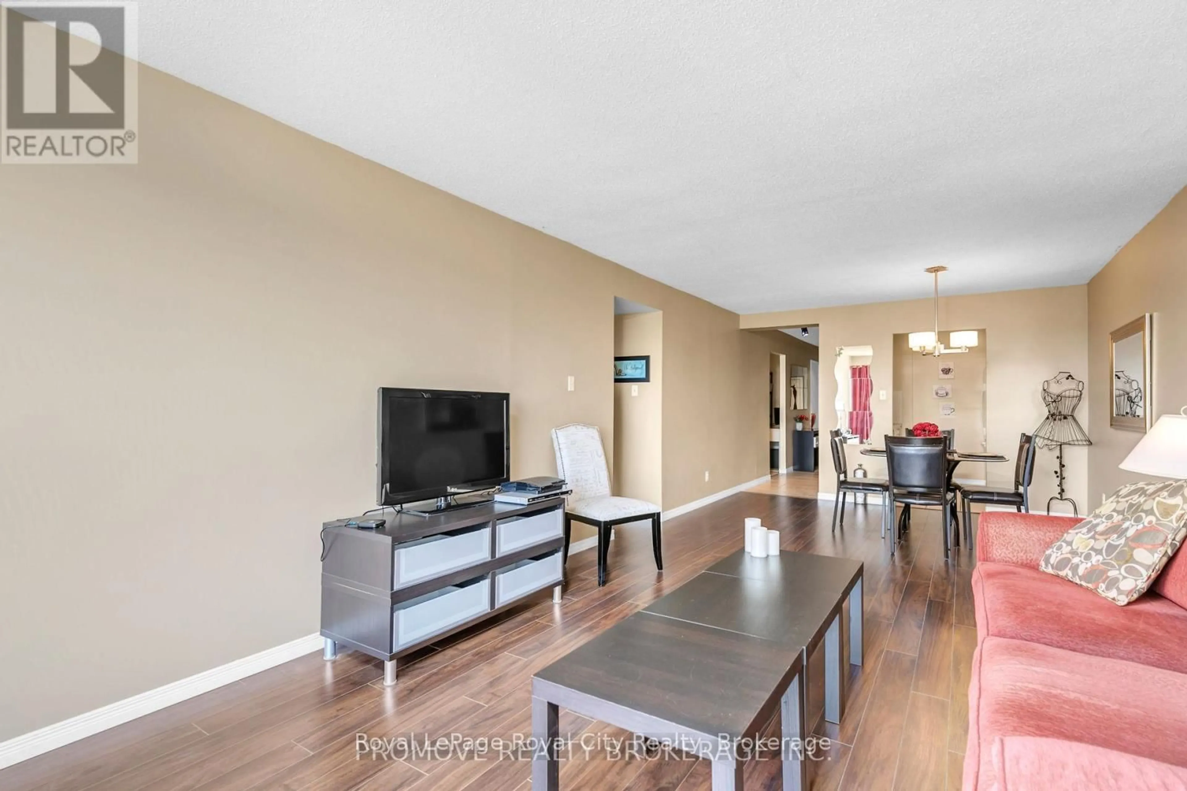 Living room with furniture, wood/laminate floor for 358 Waterloo Ave #906, Guelph Ontario N1H 7Y3