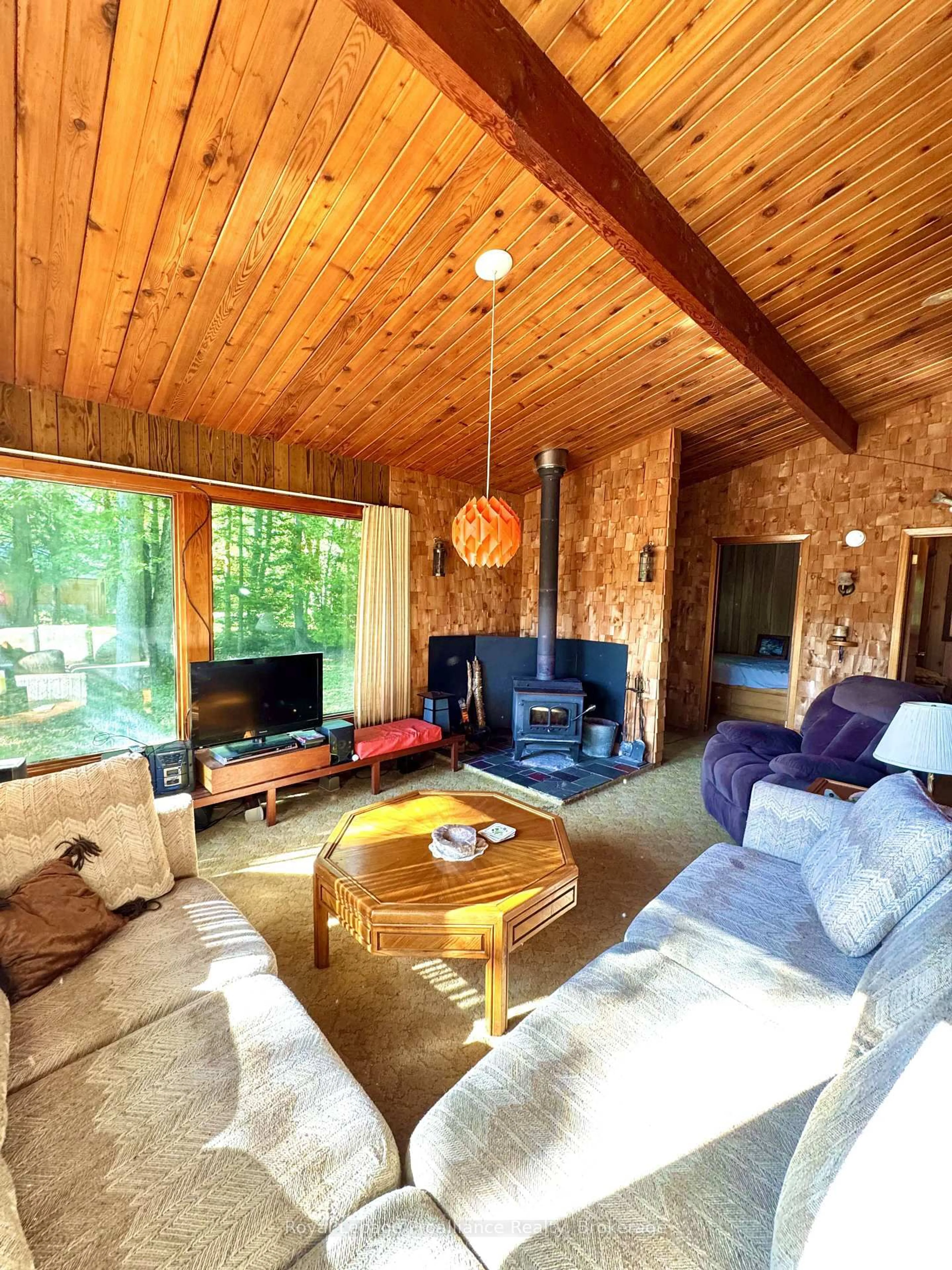 Living room with furniture, wood/laminate floor for 132 McKinnon Lane, Limoges Ontario K0K 2M0