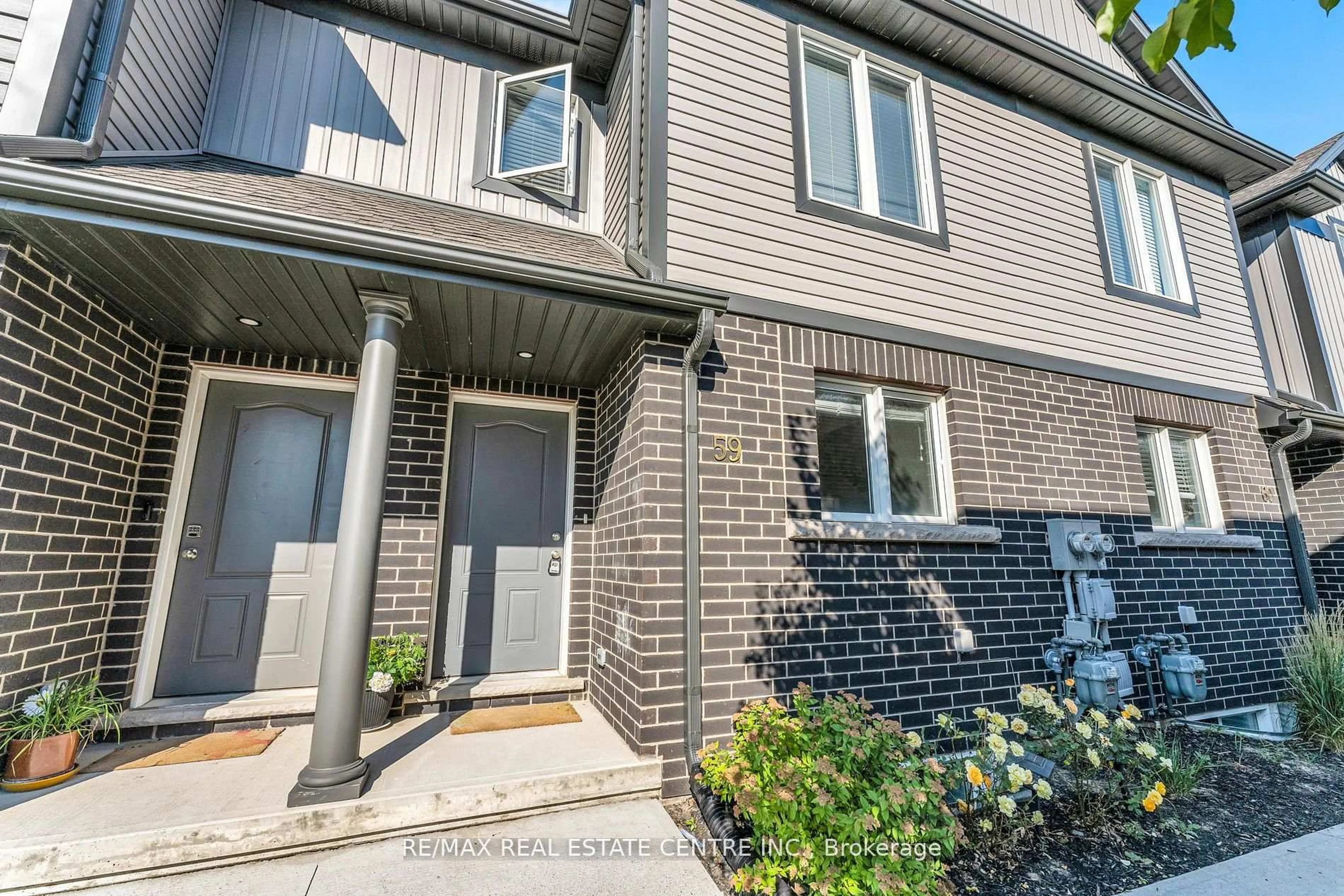 Home with brick exterior material, street for 7768 ASCOT Circ #59, Niagara Falls Ontario L2H 3P9