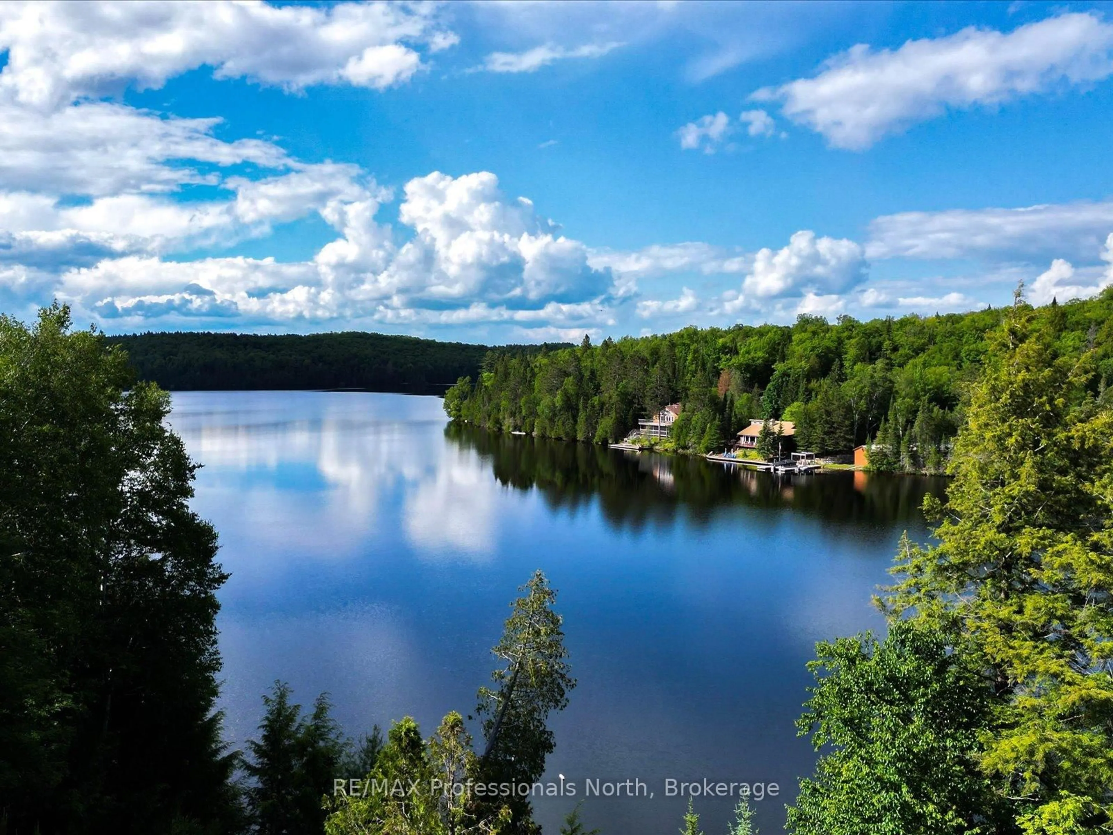 A pic from outside/outdoor area/front of a property/back of a property/a pic from drone, water/lake/river/ocean view for 84 Lakeside Lane, South Algonquin Ontario K0J 2M0