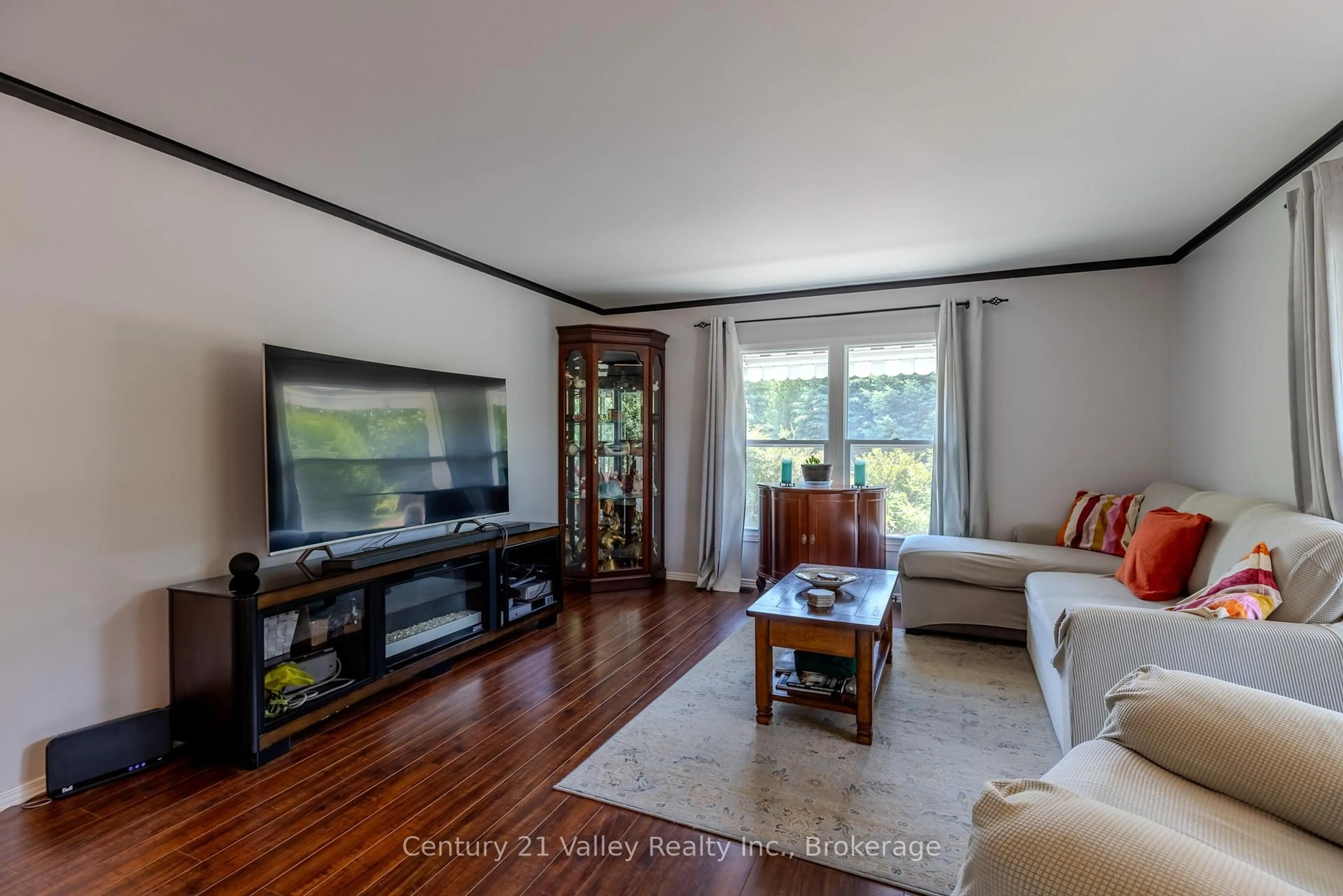 Living room with furniture, wood/laminate floor for 19 Robert Colin Lane, Cobden Ontario K0J 1K0