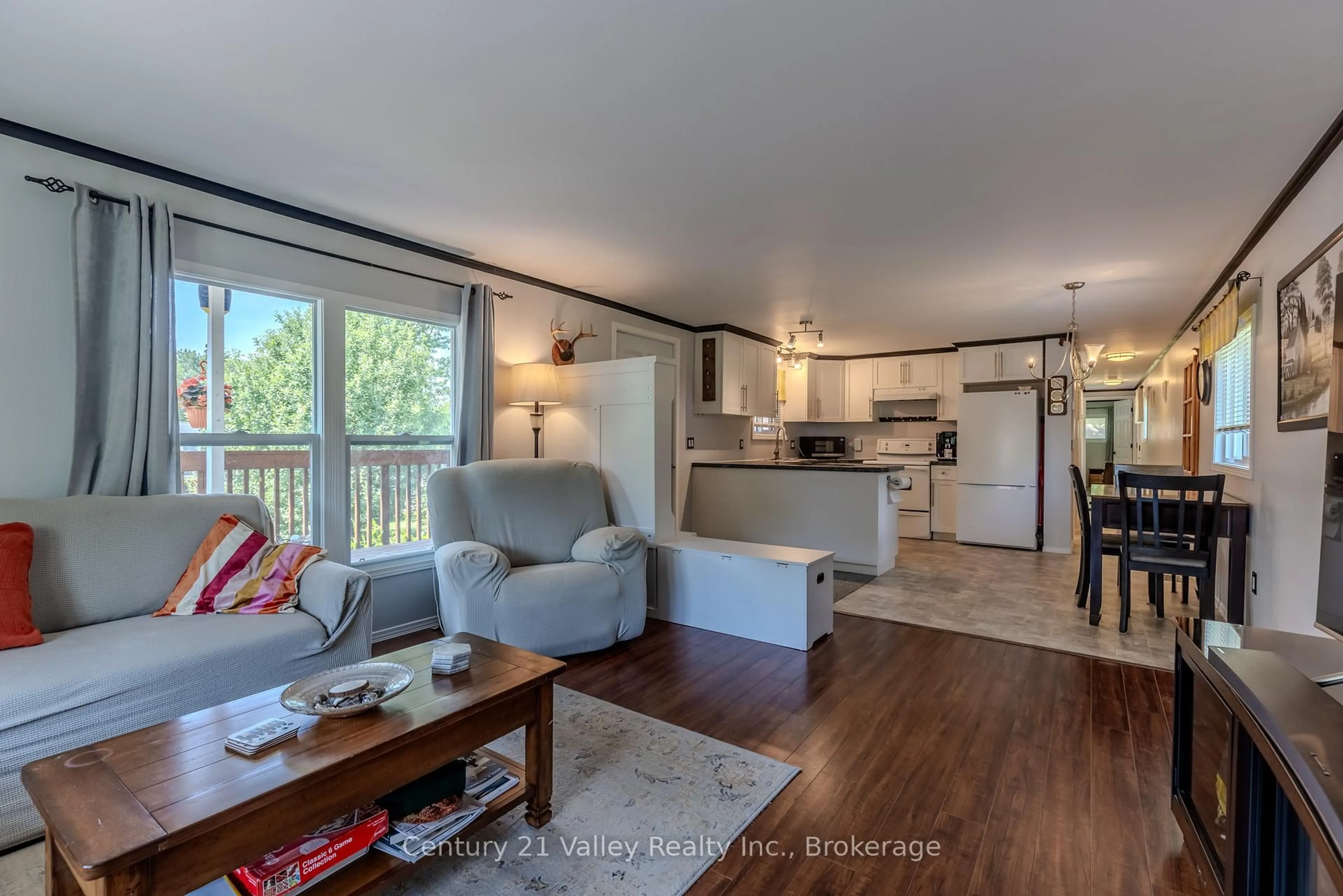 Living room with furniture, wood/laminate floor for 19 Robert Colin Lane, Cobden Ontario K0J 1K0