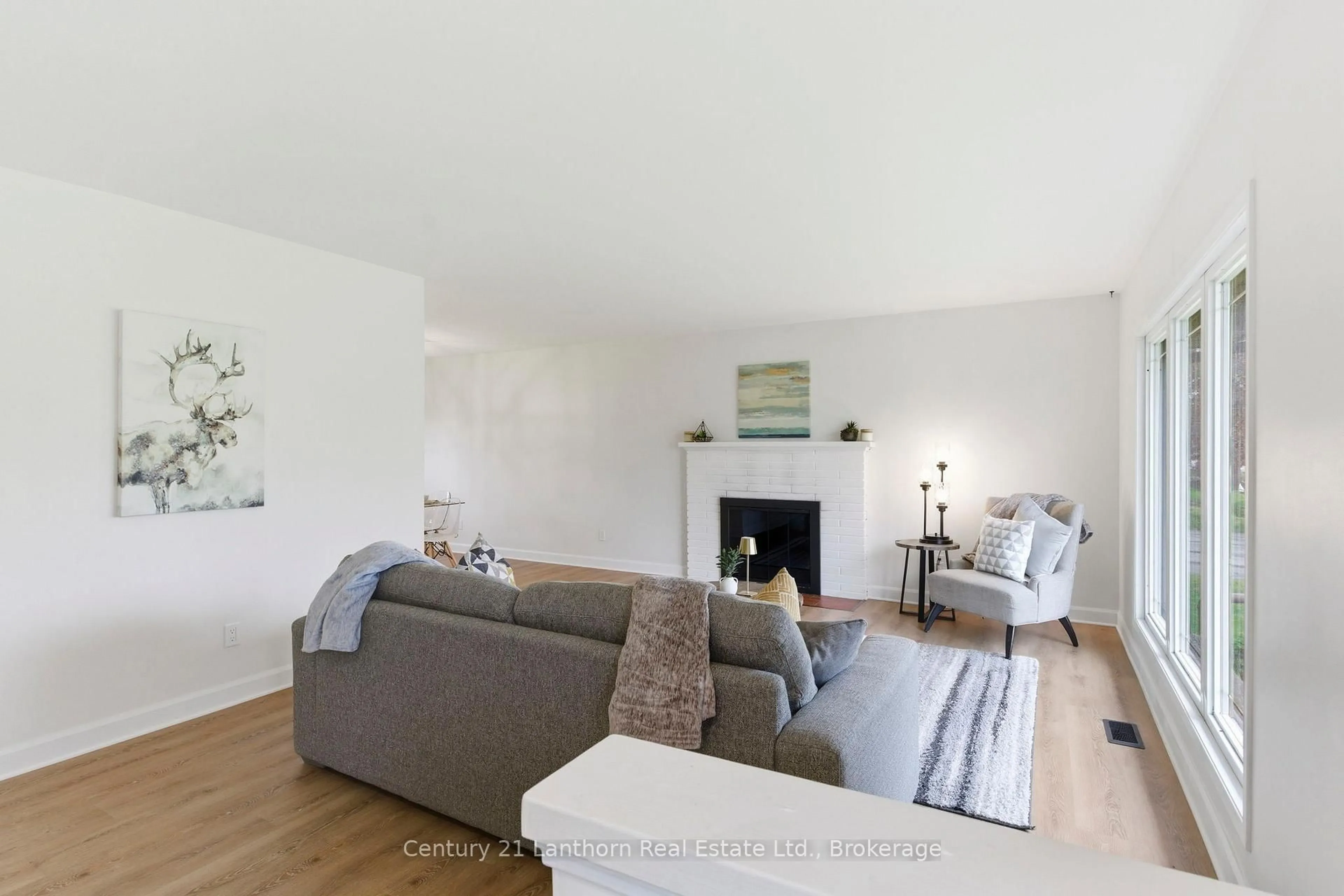 Living room with furniture, wood/laminate floor for 3517 Charleville Rd, Augusta Ontario K0E 1T0