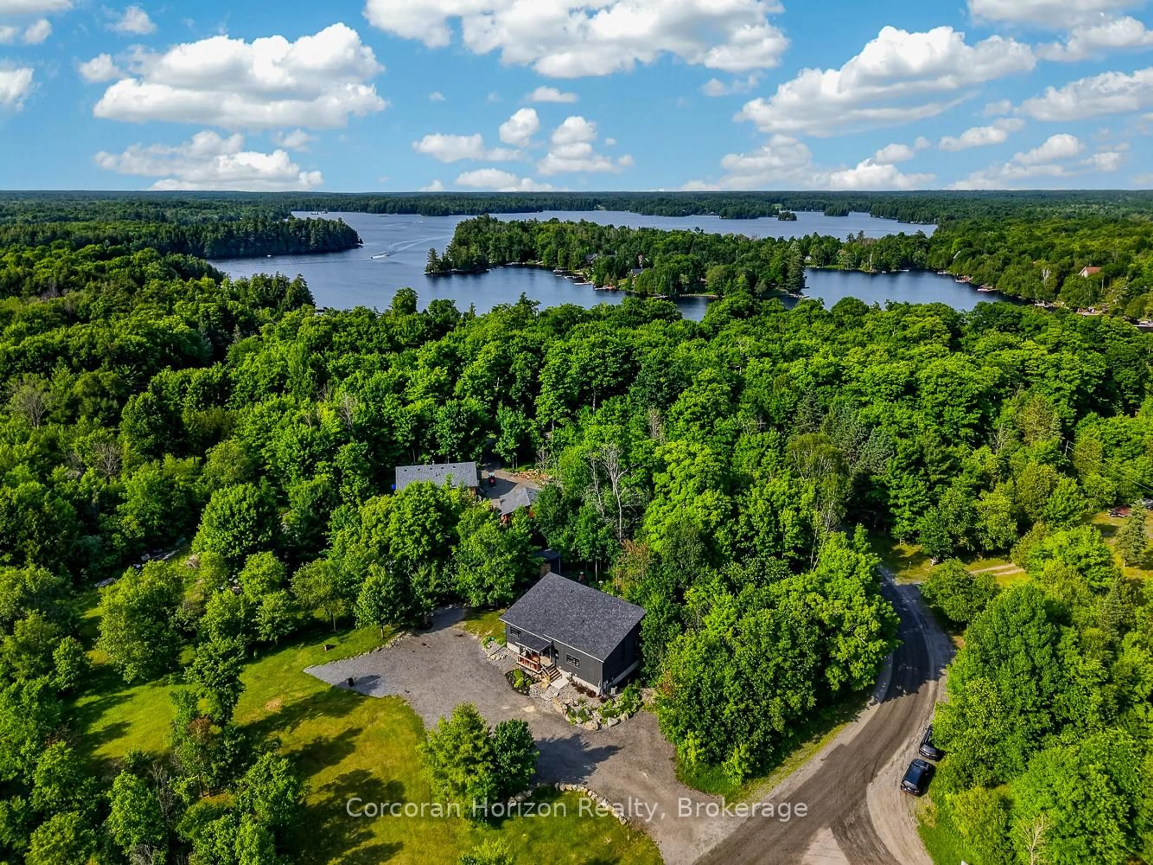 A pic from outside/outdoor area/front of a property/back of a property/a pic from drone, water/lake/river/ocean view for 9 Silver Birch Circ, McKellar Ontario P2A 0B5
