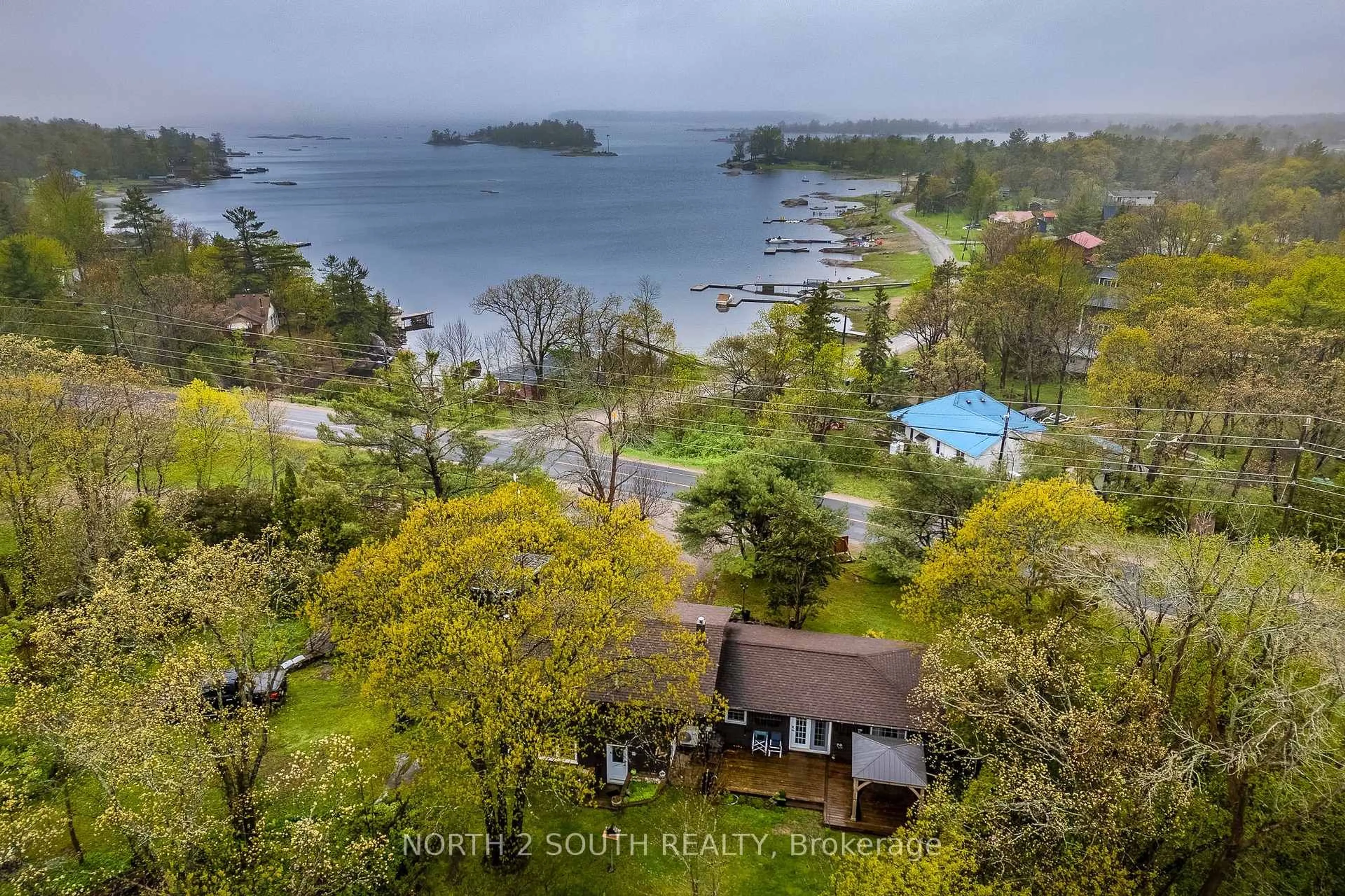 A pic from outside/outdoor area/front of a property/back of a property/a pic from drone, water/lake/river/ocean view for 1146 Honey Harbour Rd, Georgian Bay Ontario L0K 1S0