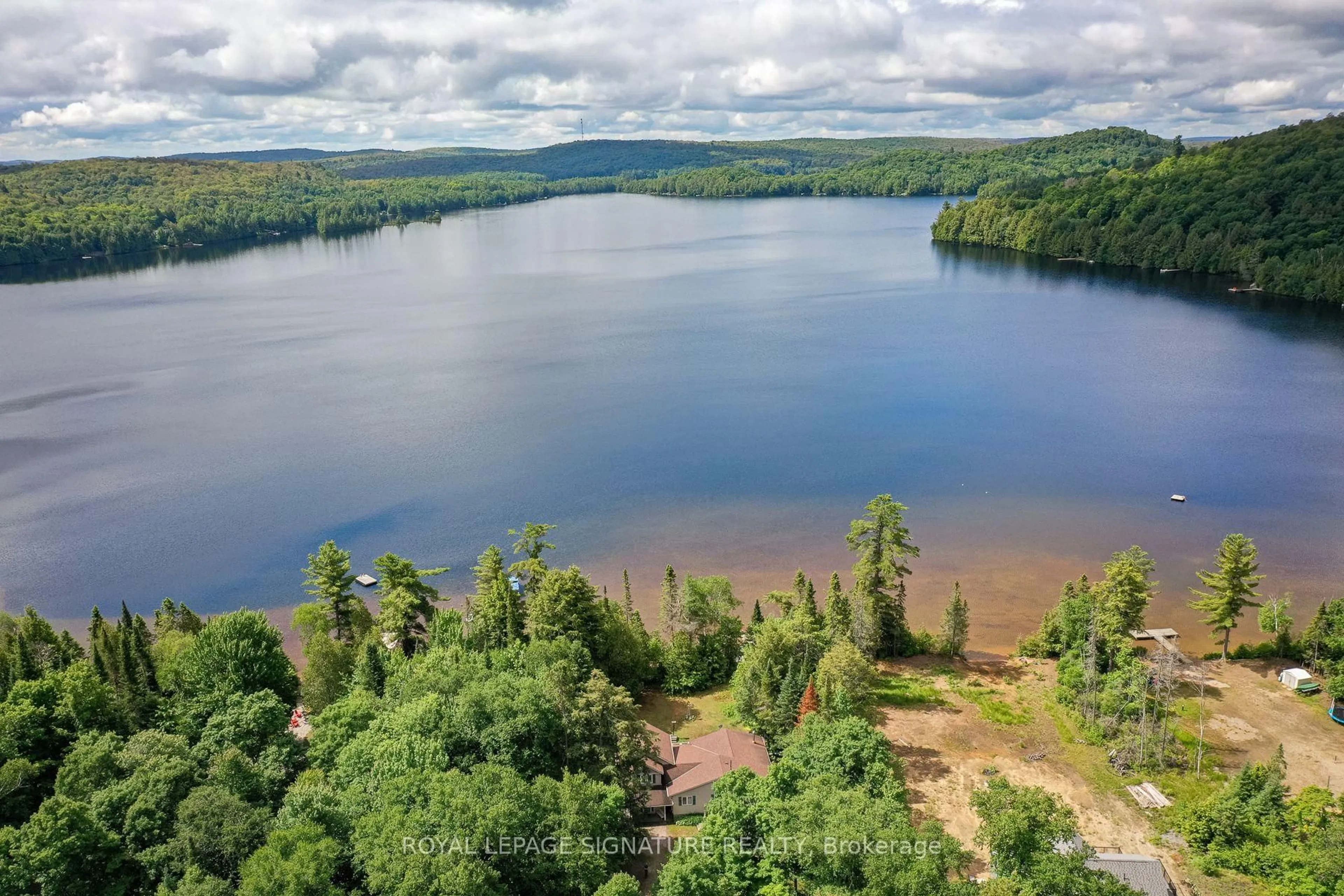 A pic from outside/outdoor area/front of a property/back of a property/a pic from drone, water/lake/river/ocean view for 1070 Grass Lake Rd, Kearney Ontario P0A 1M0