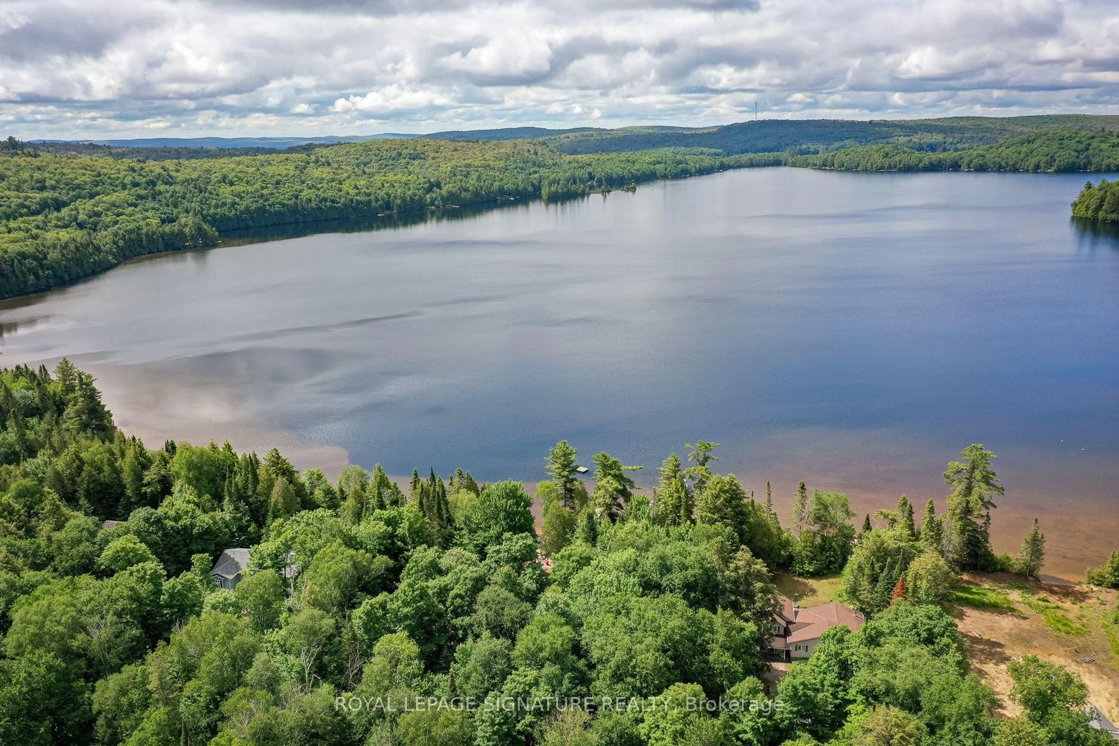 A pic from outside/outdoor area/front of a property/back of a property/a pic from drone, water/lake/river/ocean view for 1070 Grass Lake Rd, Kearney Ontario P0A 1M0