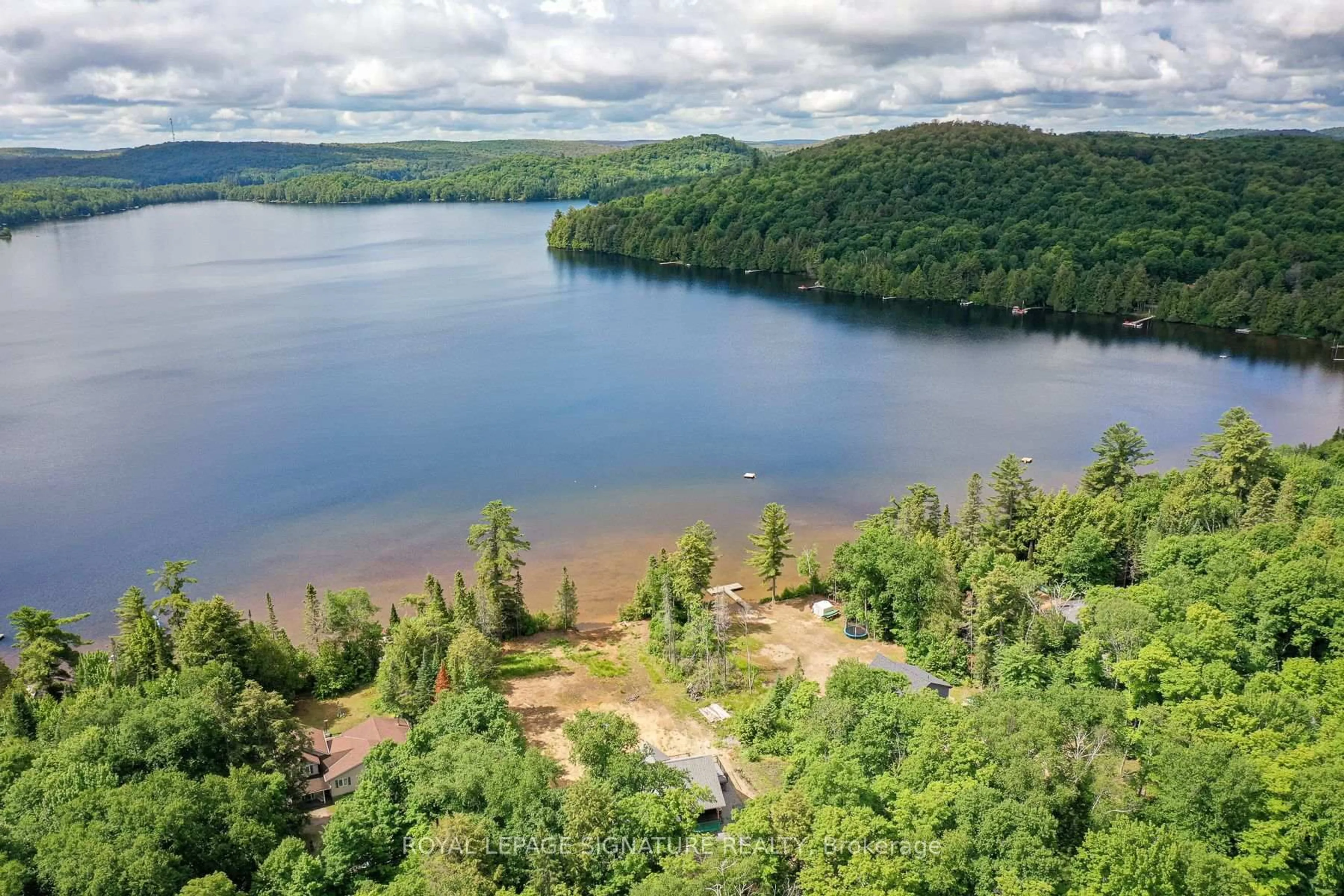 A pic from outside/outdoor area/front of a property/back of a property/a pic from drone, water/lake/river/ocean view for 1070 Grass Lake Rd, Kearney Ontario P0A 1M0