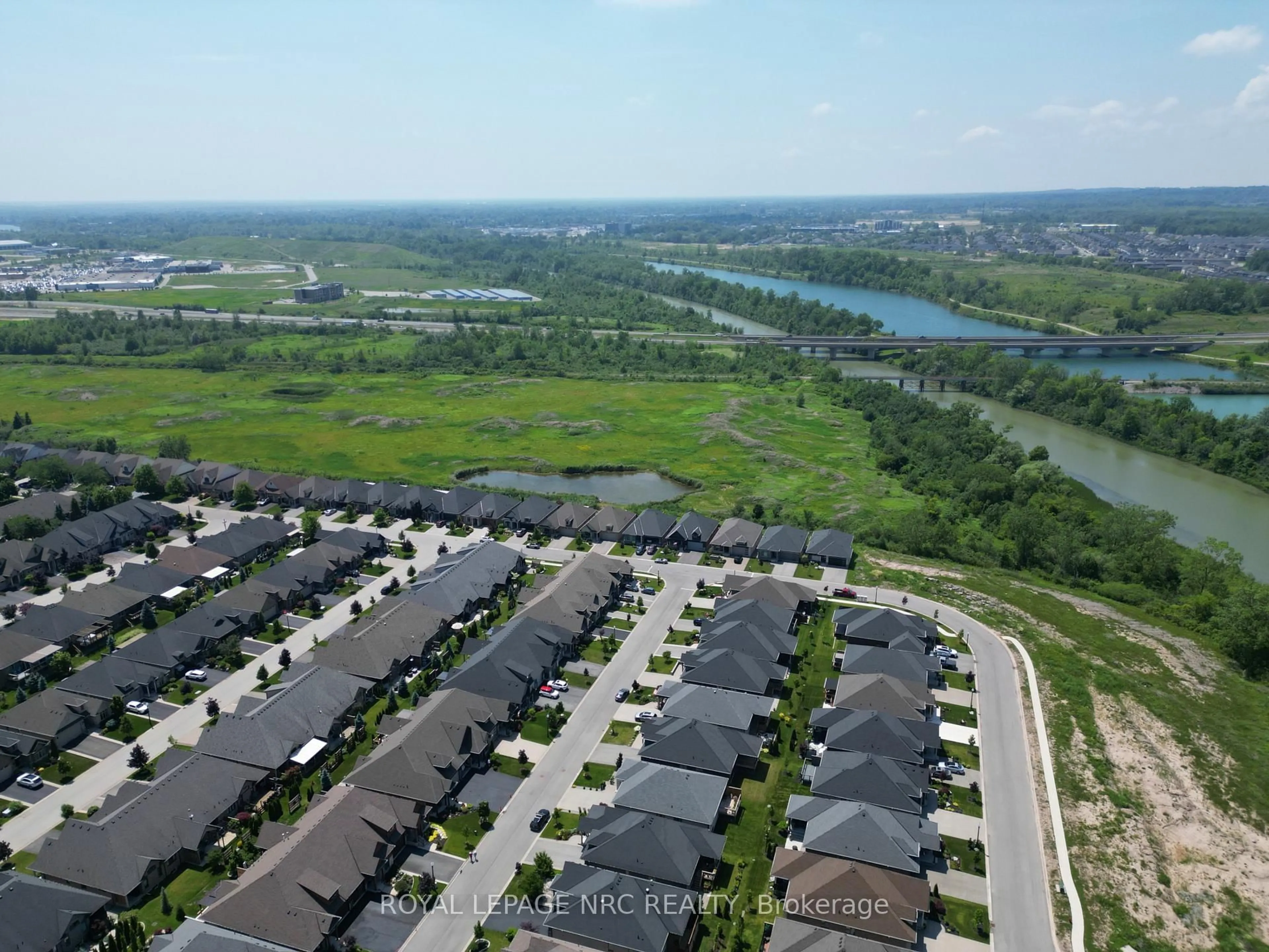 A pic from outside/outdoor area/front of a property/back of a property/a pic from drone, water/lake/river/ocean view for 53 Carrick Tr, Welland Ontario L3B 0E7