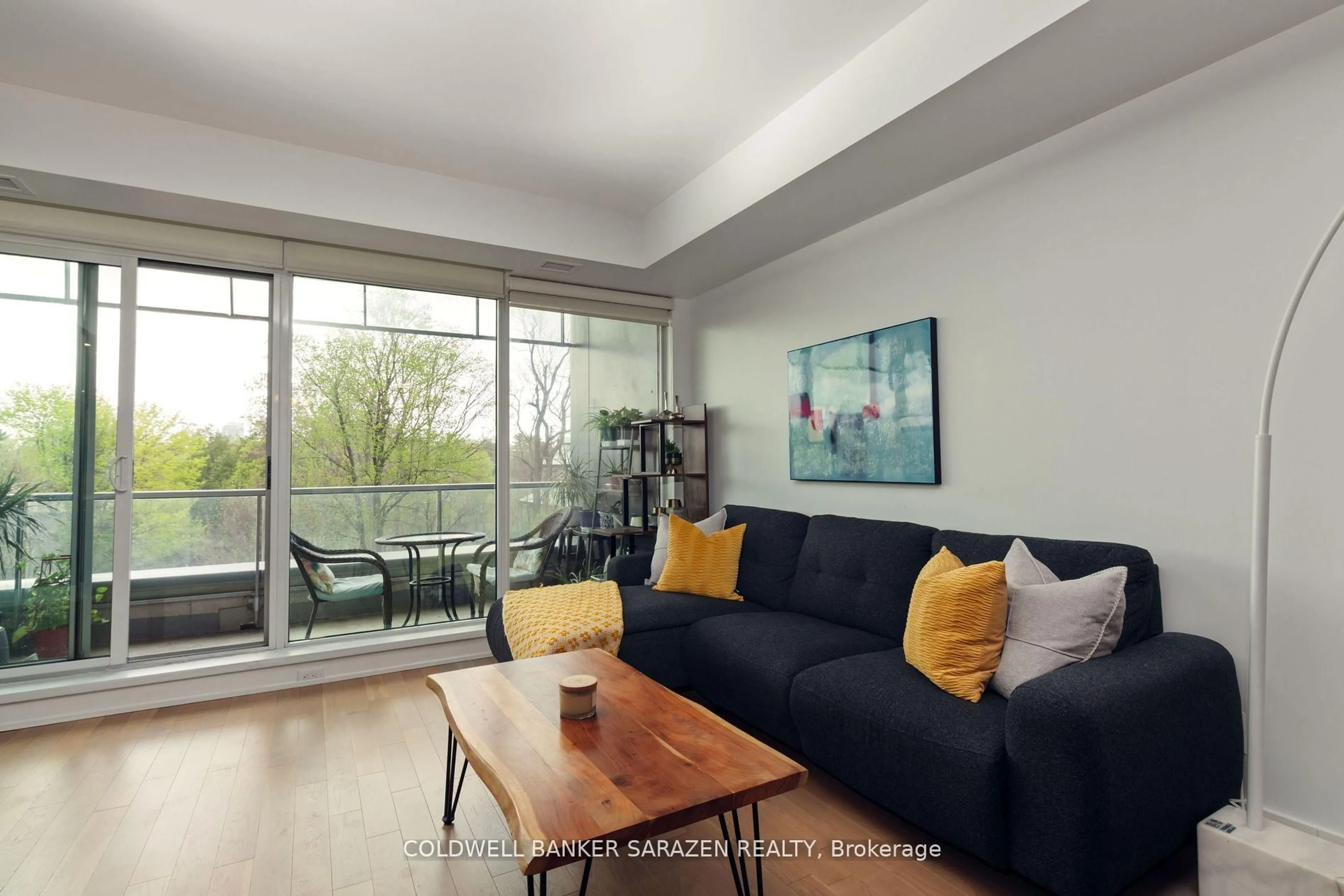 Living room with furniture, wood/laminate floor for 98 Richmond Rd #306, Ottawa Ontario K1Z 0B2