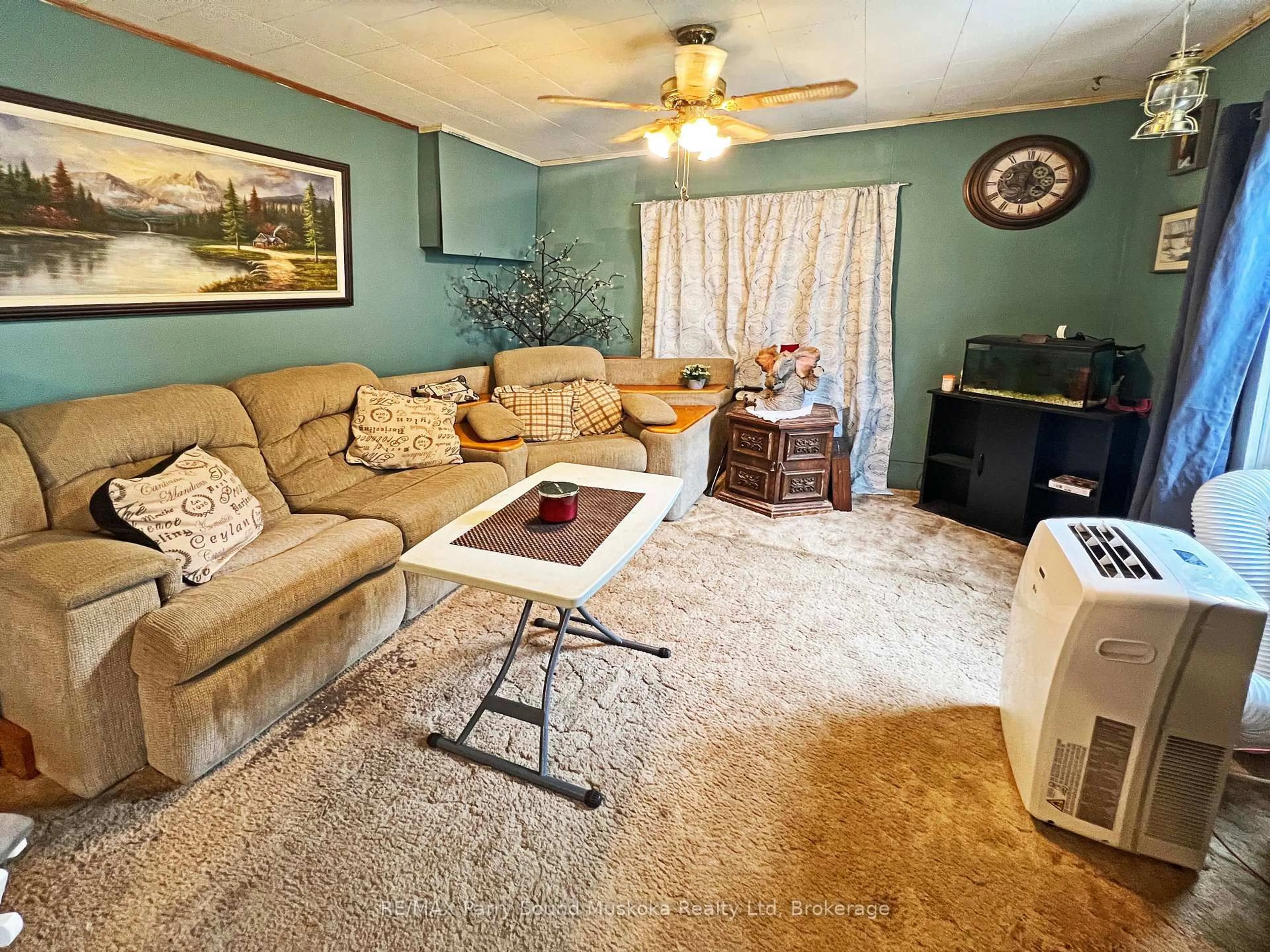Living room with furniture, carpet floor for 11 Adelaide St, Parry Sound Ontario P2A 1H2