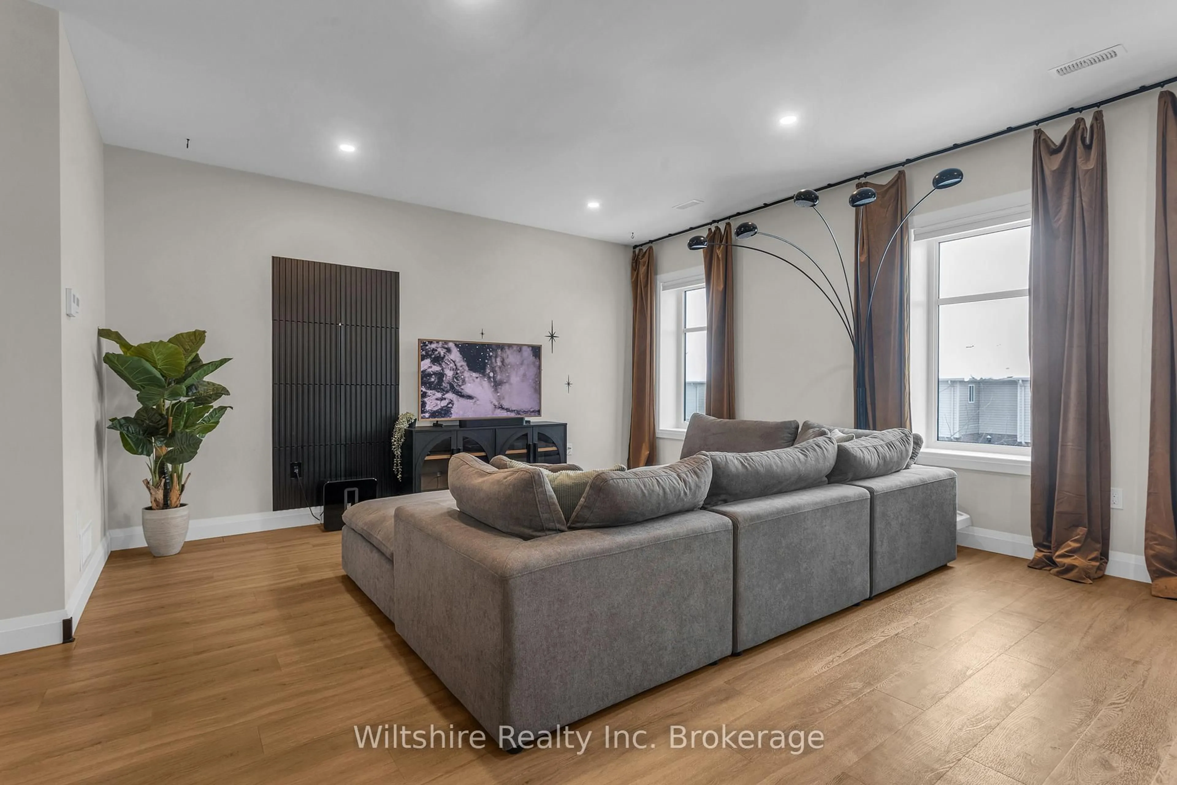 Living room with furniture, wood/laminate floor for 361 Quarter Town Line #1105, Tillsonburg Ontario N4G 0K2