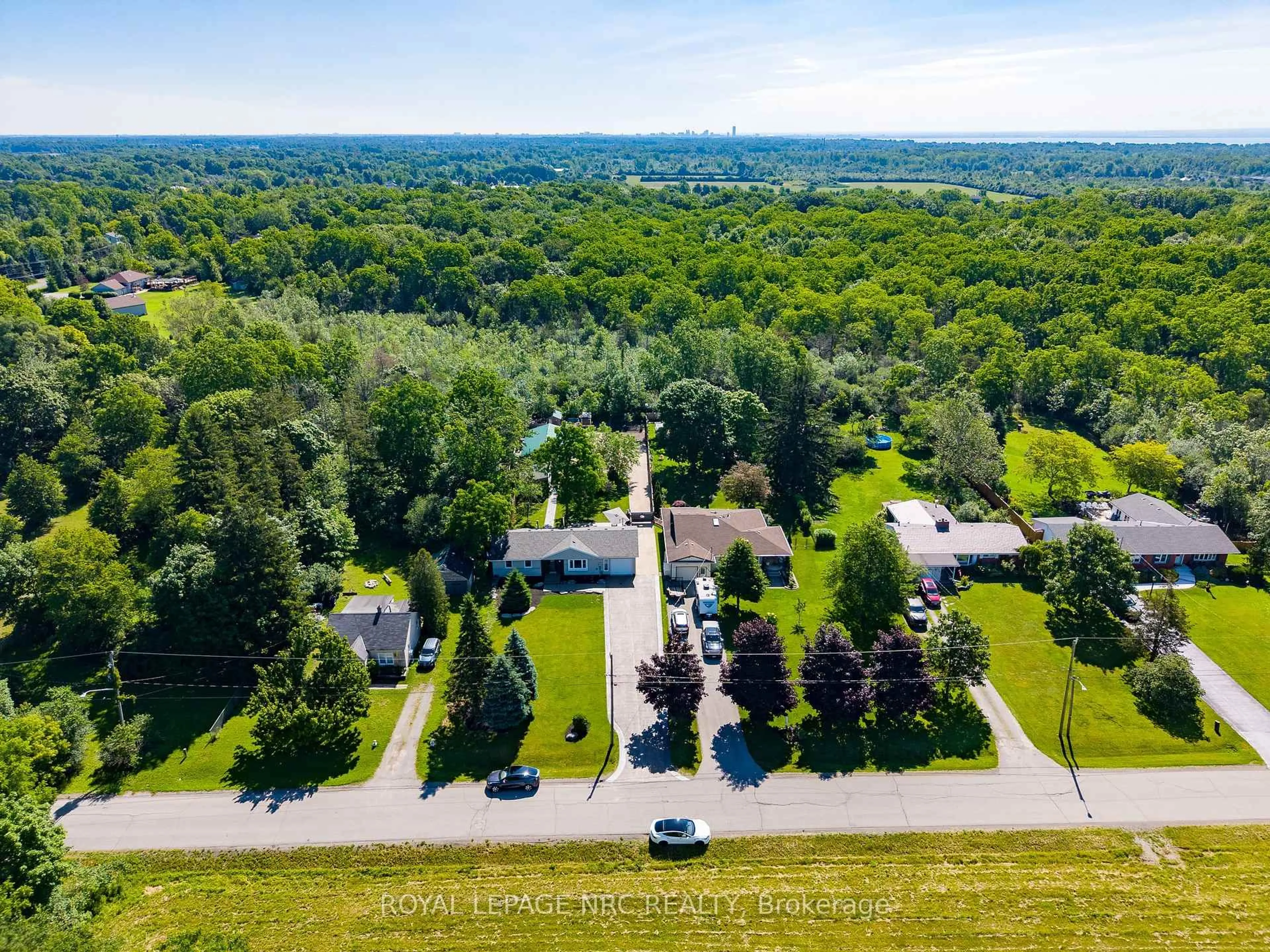 A pic from outside/outdoor area/front of a property/back of a property/a pic from drone, forest/trees view for 646 Prospect Point Rd, Fort Erie Ontario L0S 1N0
