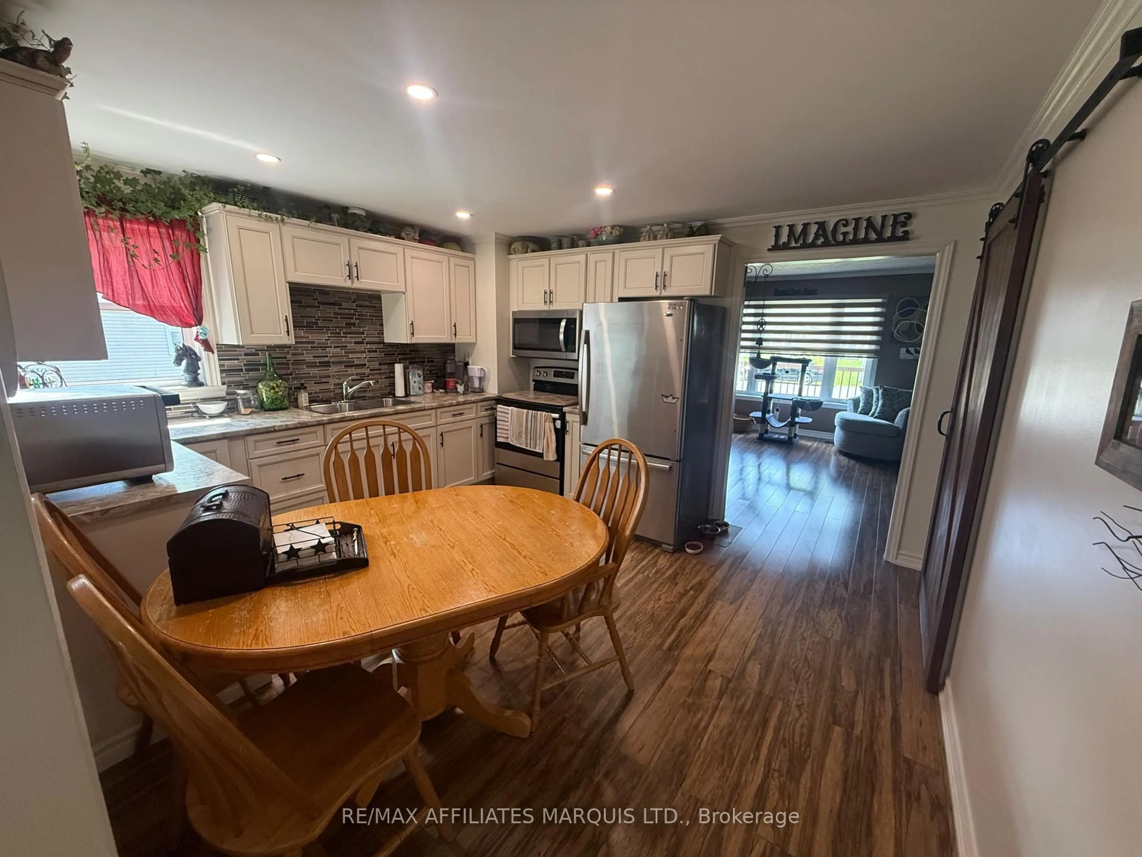 Open concept kitchen, wood/laminate floor for 6679 Lawrence St, South Glengarry Ontario K6H 5R5