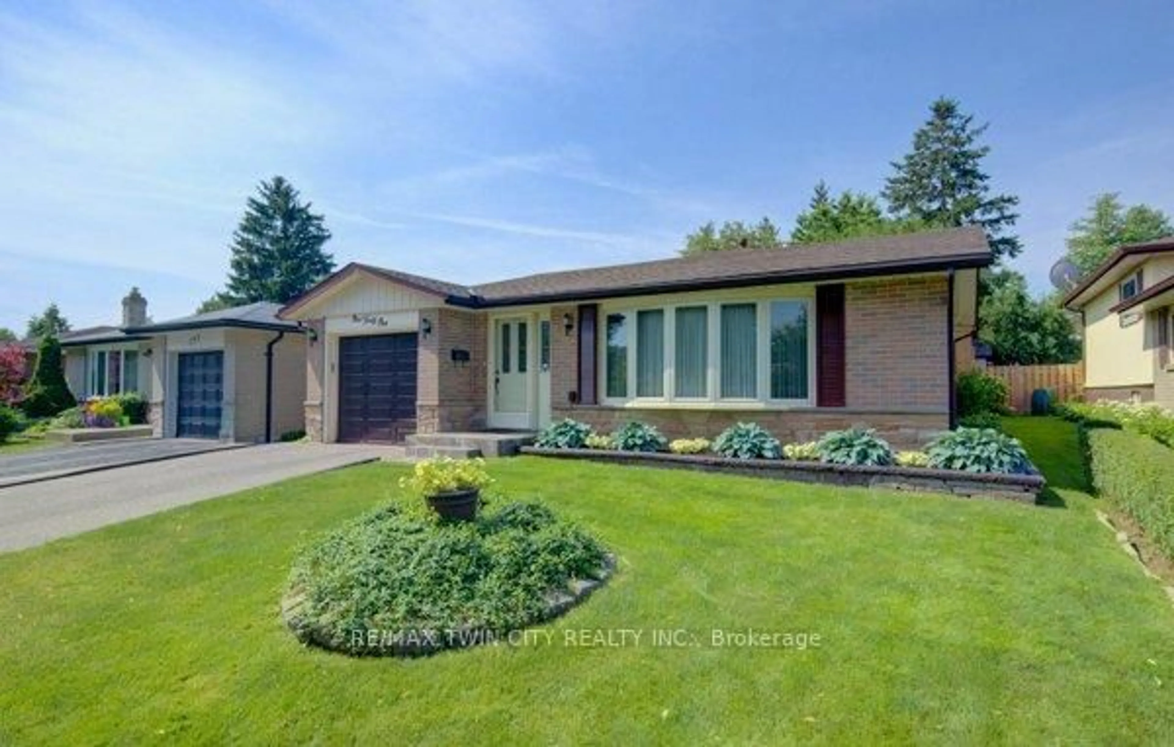 Home with brick exterior material, street for 141 Hazelglen Dr, Kitchener Ontario N2M 2E6