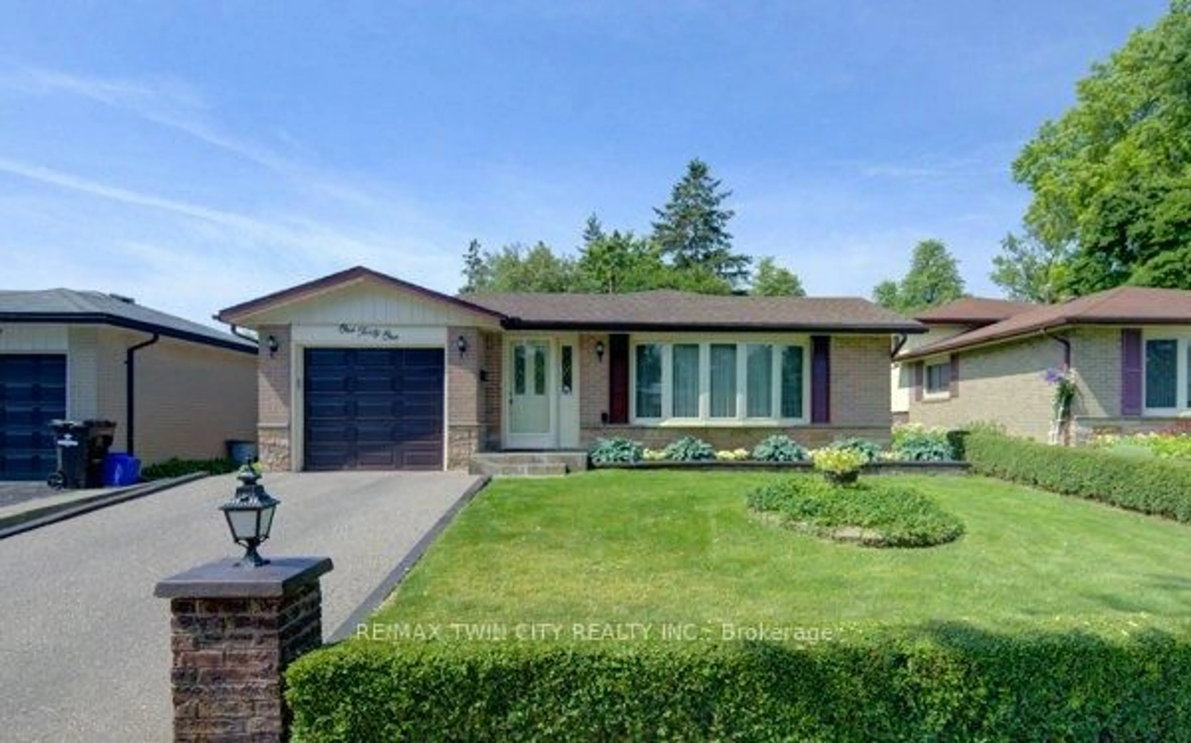 Home with brick exterior material, street for 141 Hazelglen Dr, Kitchener Ontario N2M 2E6