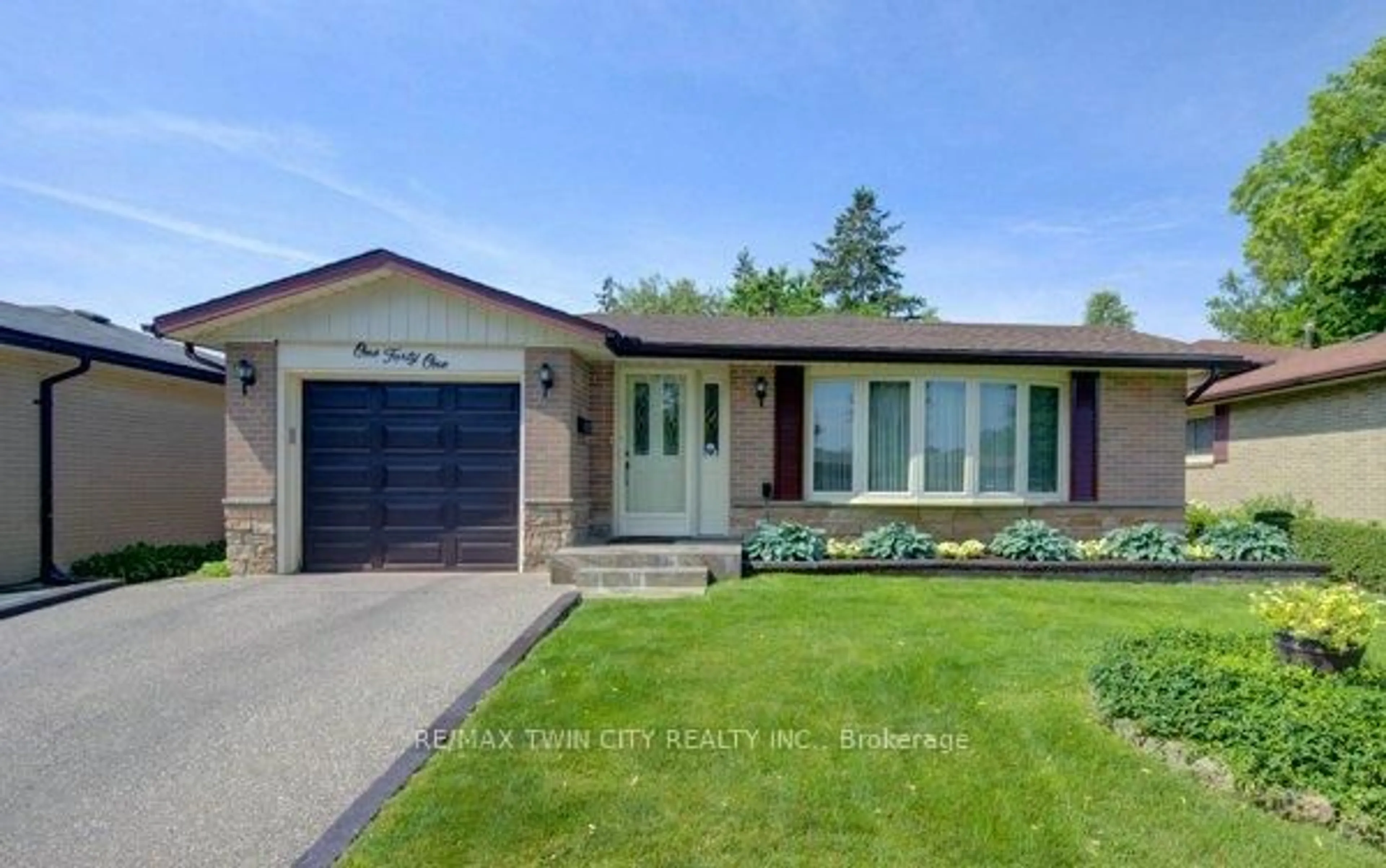 Home with brick exterior material, street for 141 Hazelglen Dr, Kitchener Ontario N2M 2E6