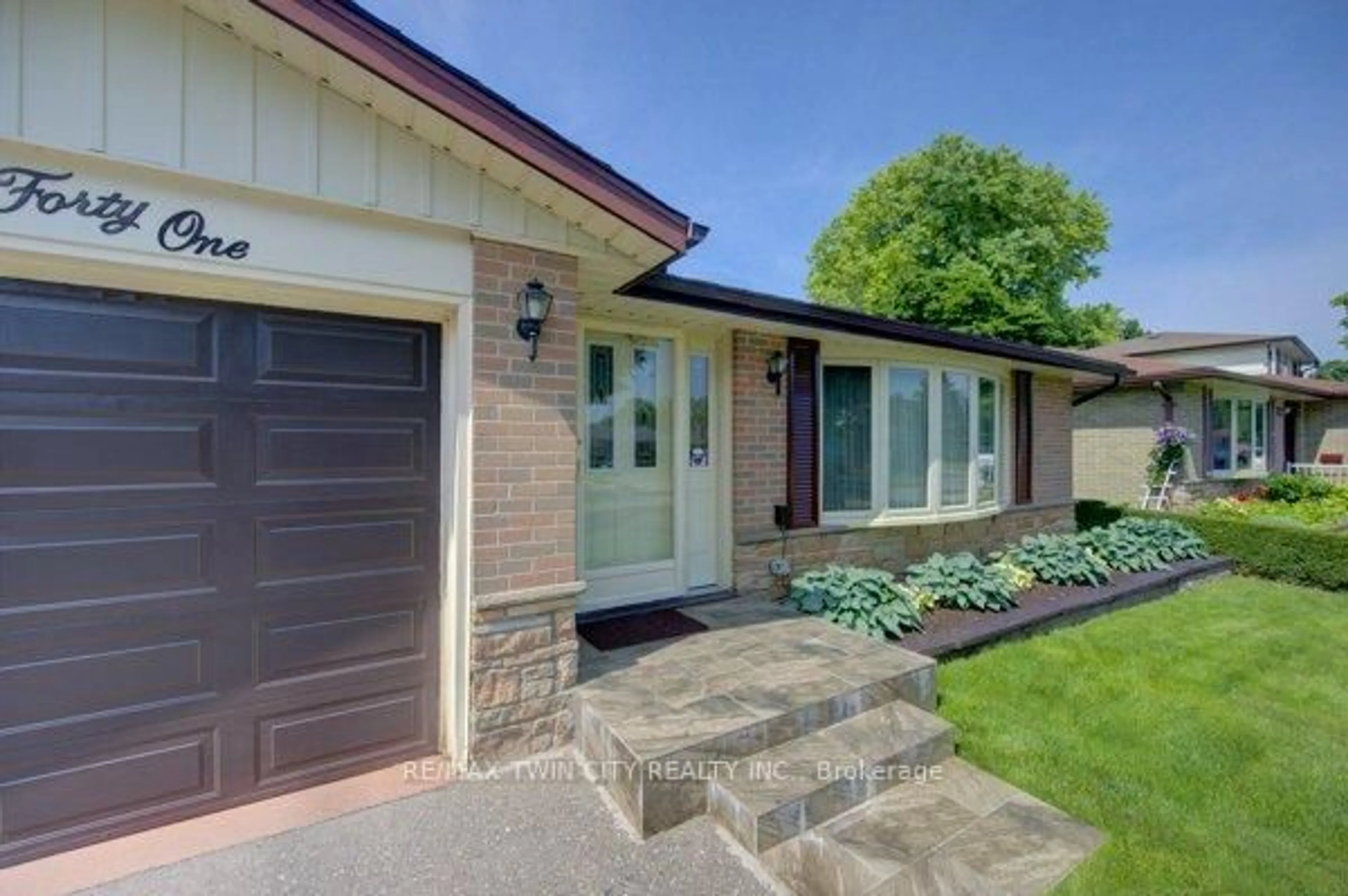 Home with brick exterior material, street for 141 Hazelglen Dr, Kitchener Ontario N2M 2E6
