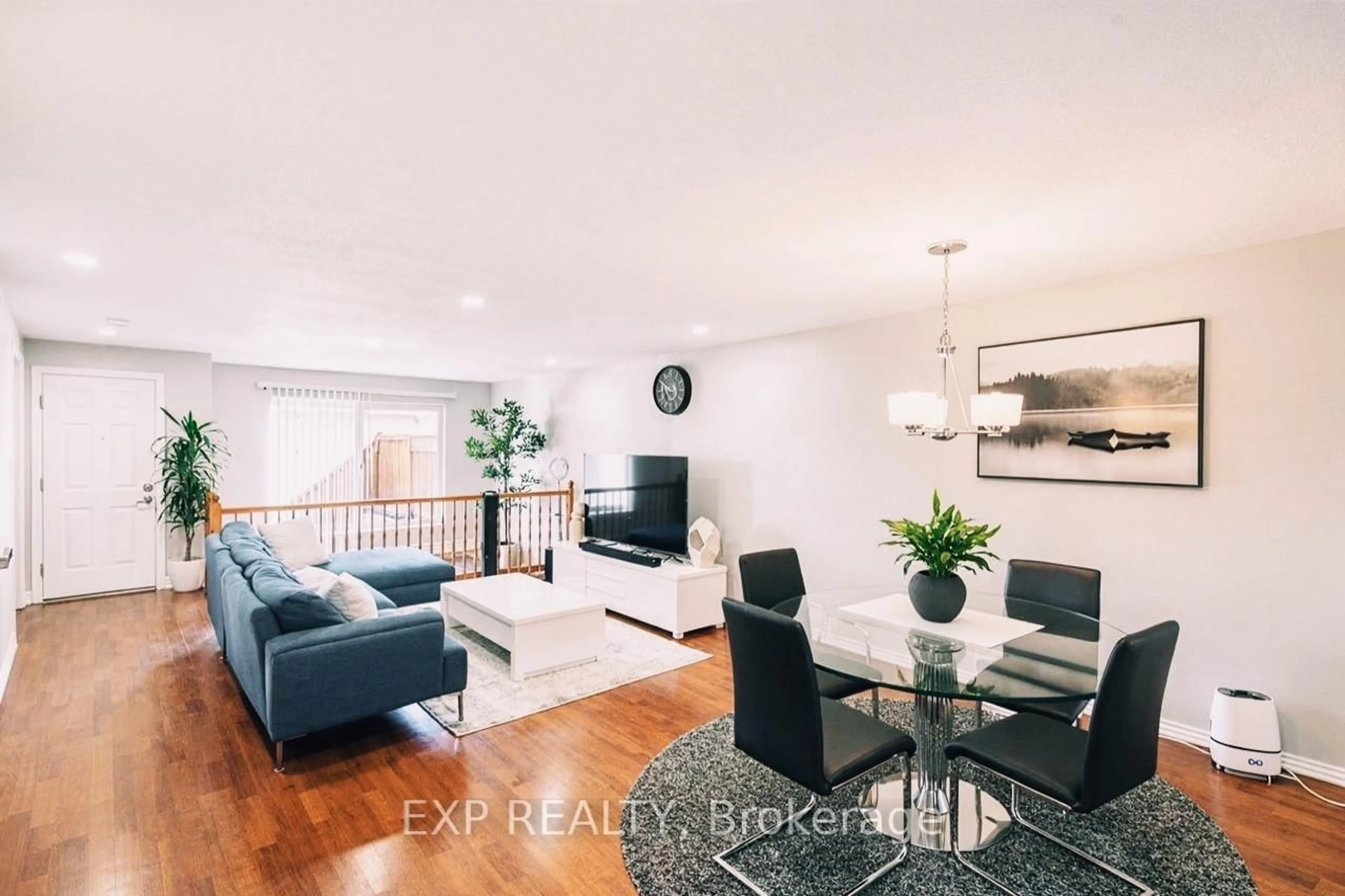 Living room with furniture, wood/laminate floor for 1512 WALKLEY Rd #100, Ottawa Ontario K1V 2G5