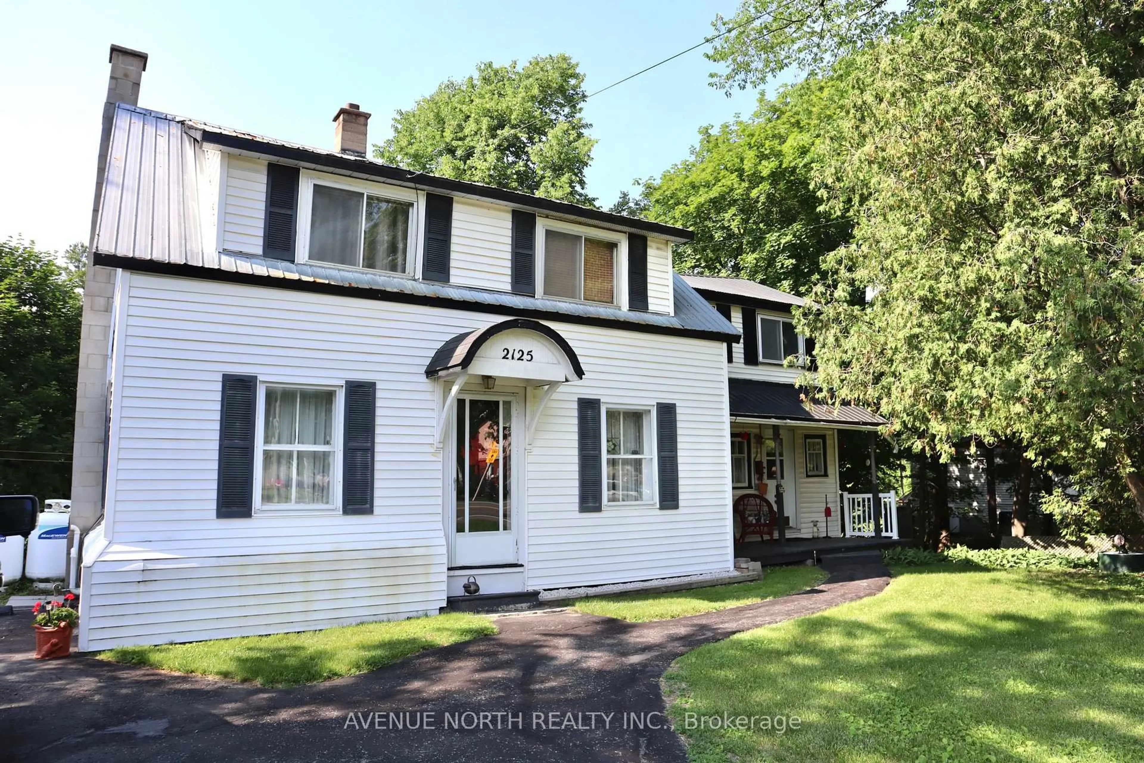 Home with vinyl exterior material, street for 2125 Old Montreal Rd, Ottawa Ontario K4C 1G7