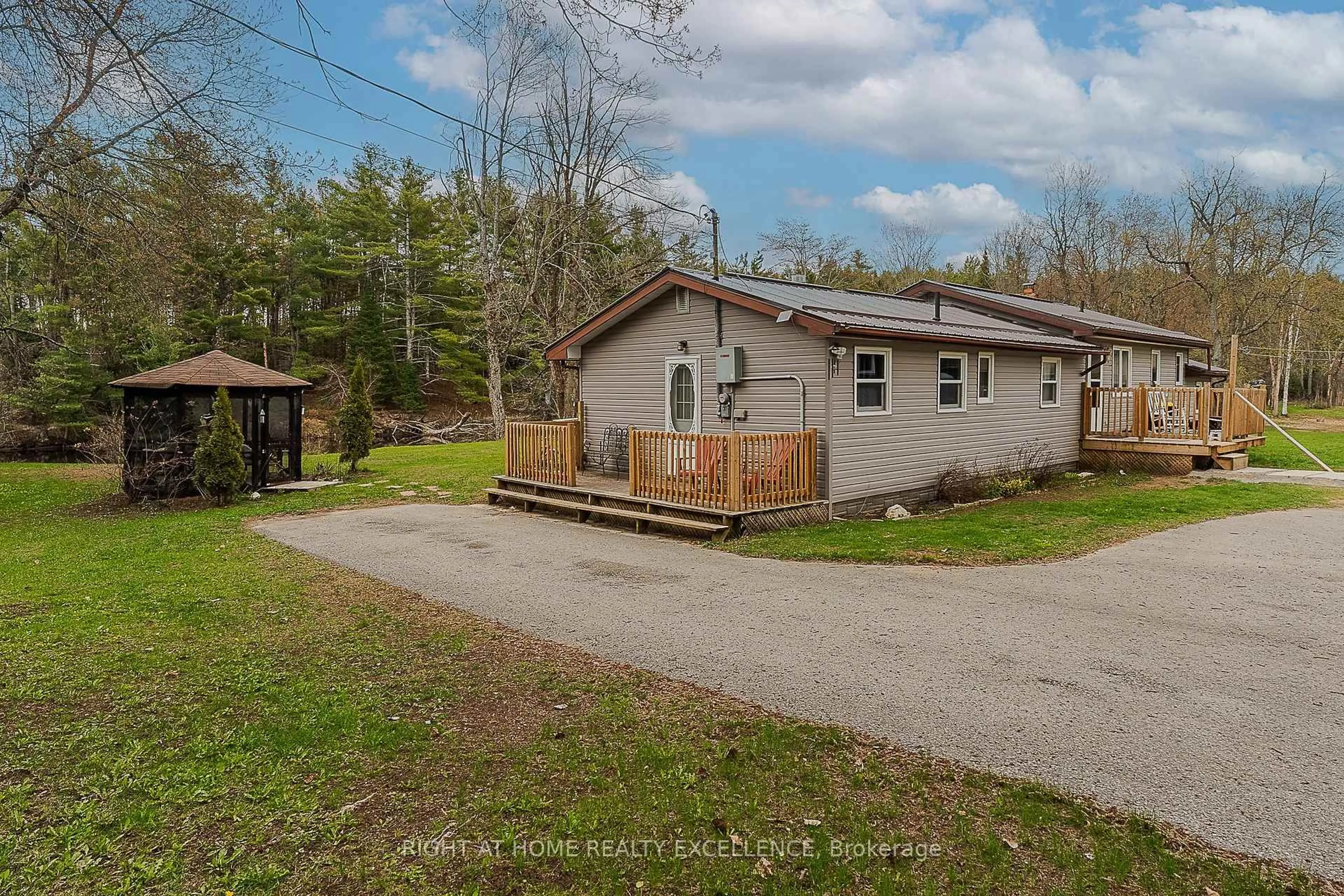 A pic from outside/outdoor area/front of a property/back of a property/a pic from drone, street for 1246 Howland Junction Rd, Minden Hills Ontario K0M 2A1