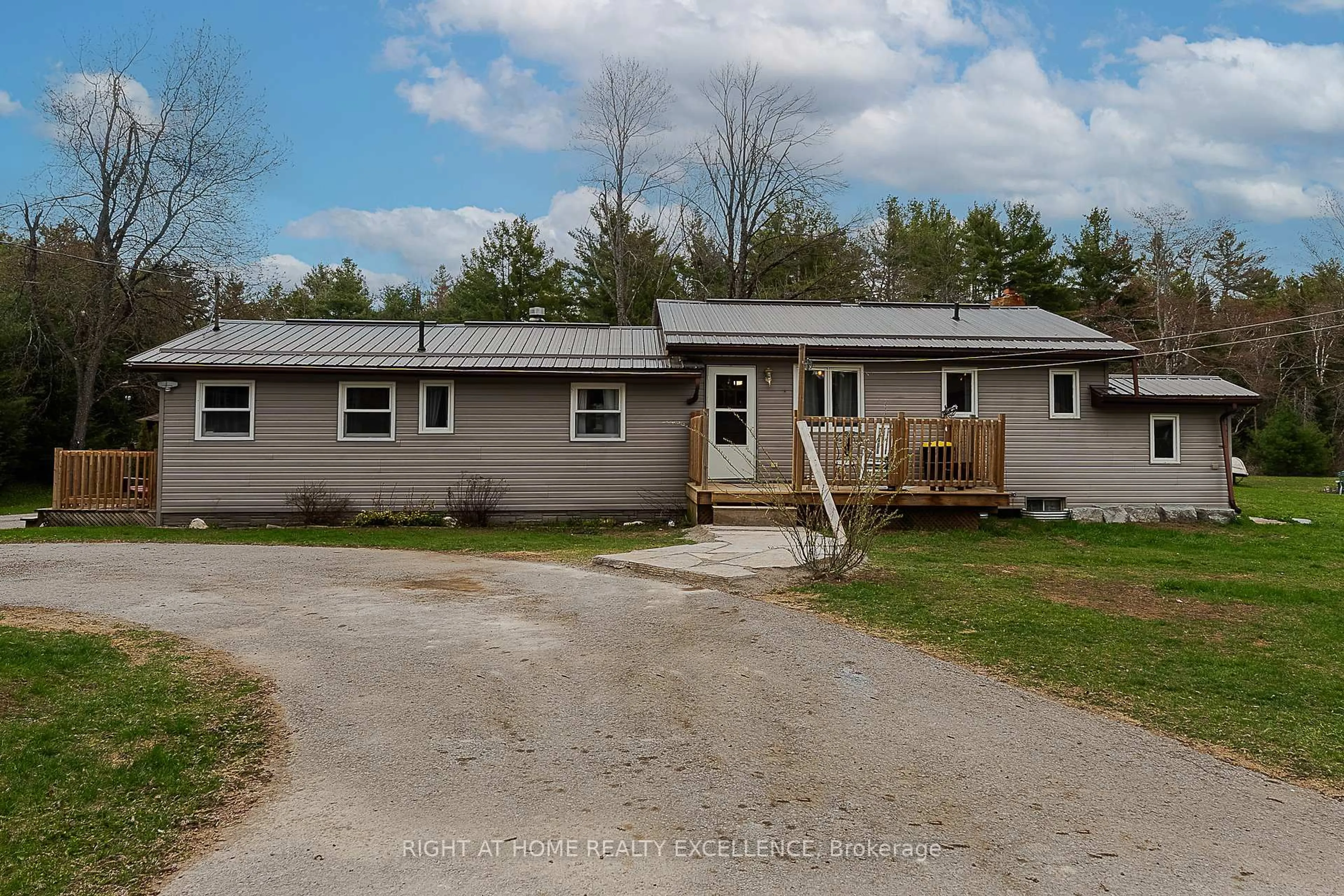A pic from outside/outdoor area/front of a property/back of a property/a pic from drone, street for 1246 Howland Junction Rd, Minden Hills Ontario K0M 2A1