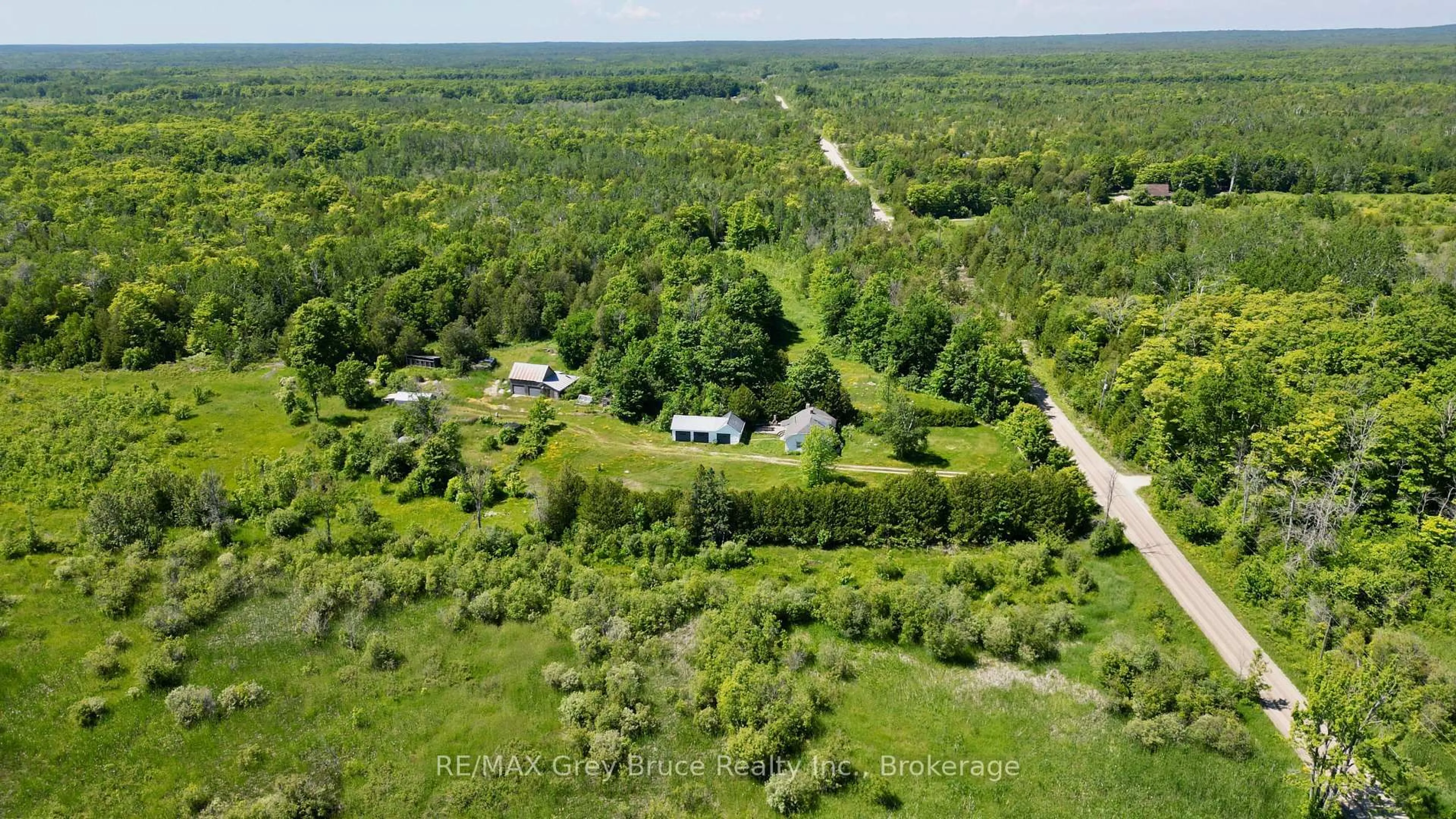 A pic from outside/outdoor area/front of a property/back of a property/a pic from drone, forest/trees view for 43 Bartley Dr, Northern Bruce Peninsula Ontario N0H 1Z0